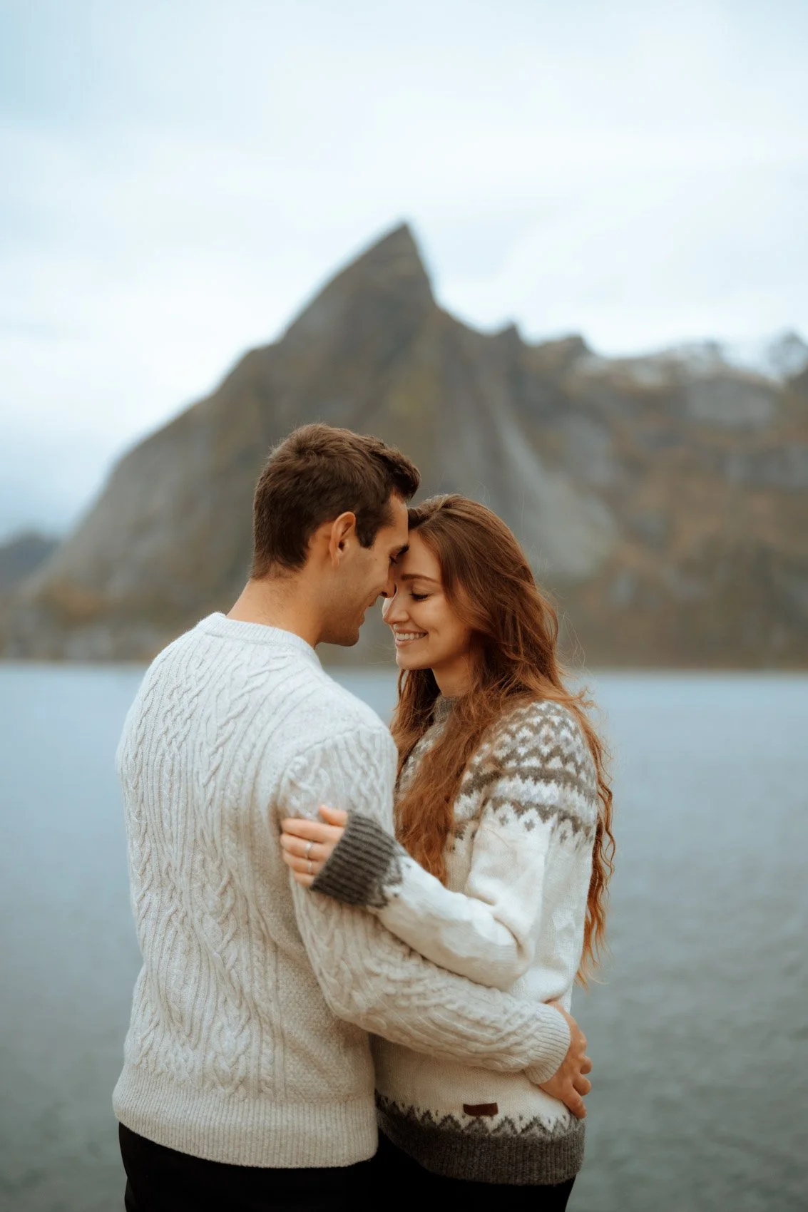 Couple portrait in dramatic Lofoten mountain landscape