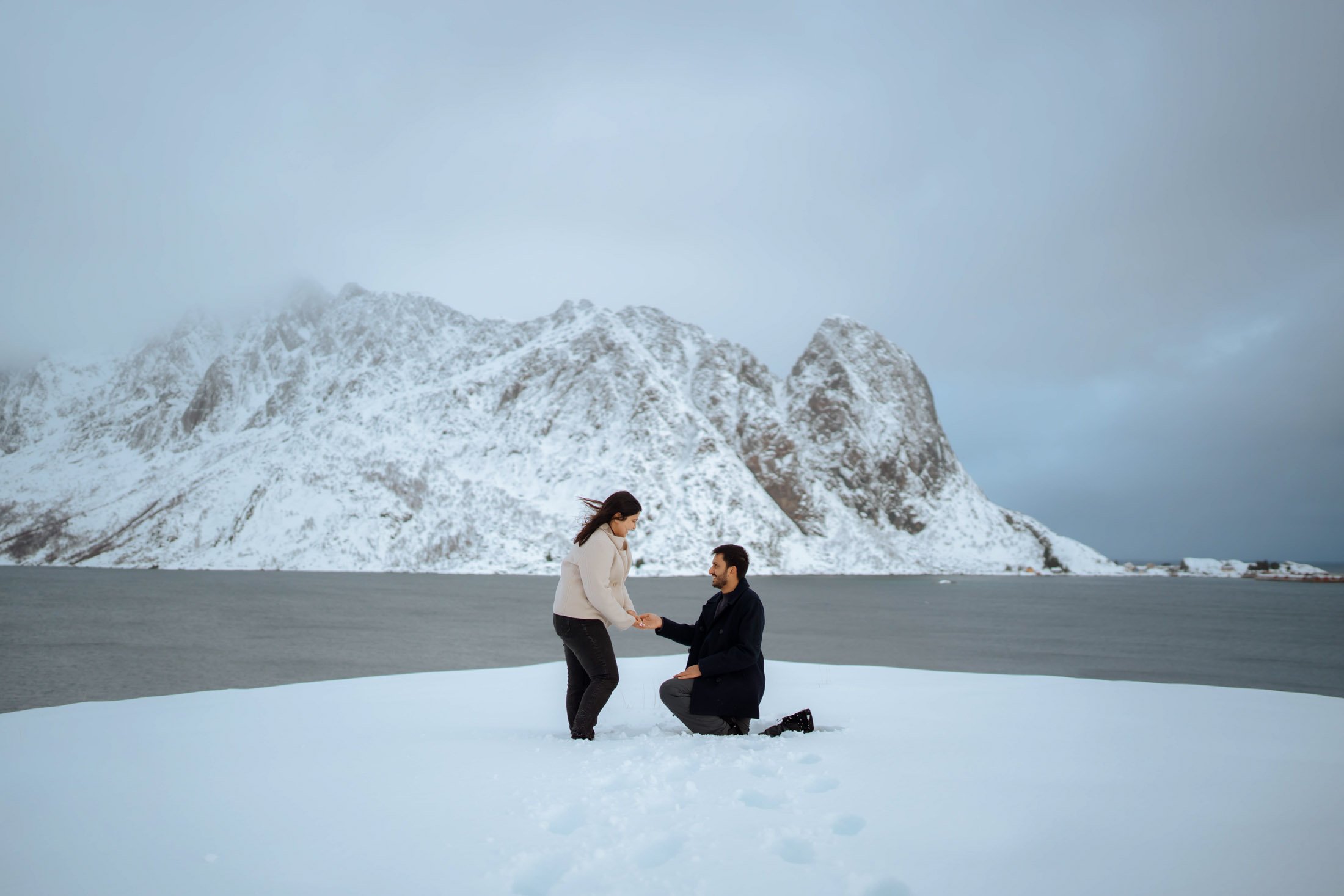 Winter suprise proposal in snowy Lofoten mountains