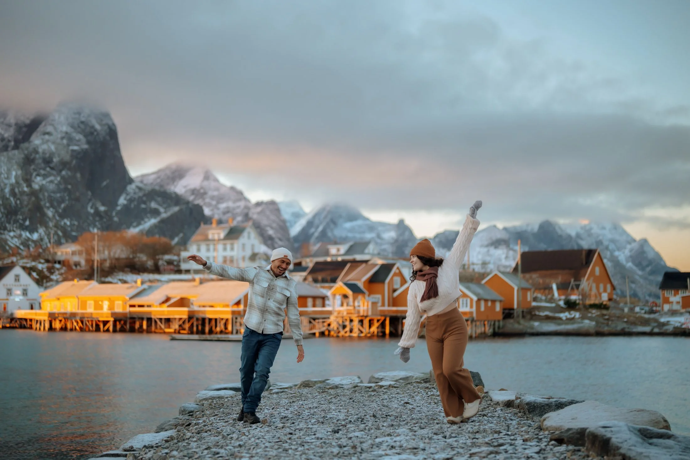 Couple photoshoot in Lofoten near traditional red fishing cabins
