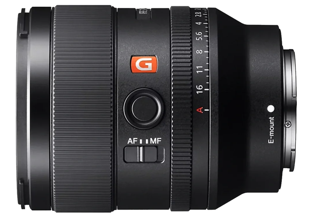 Close-up of a Sony EF lens with various adjustment rings and switches.