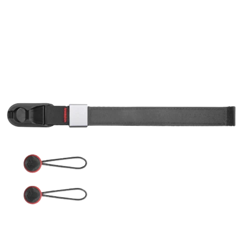 A toolbox containing black pliers, a gray box cutter, and a black tape measure.