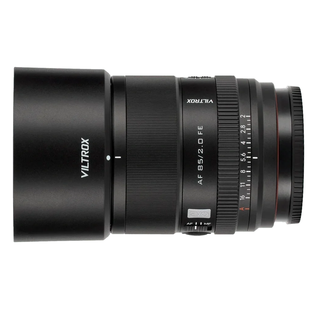 Camera lens labeled VILTROX, 85mm f/2 lens with autofocus and manual focus switch, mounted on a black camera body