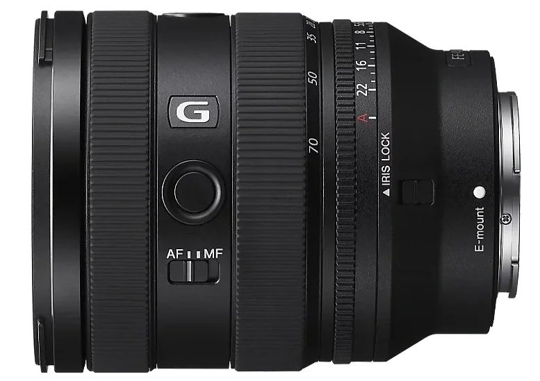 A black professional camera lens with various markings and switches, including a focus mode switch and an aperture ring, shown from the side.