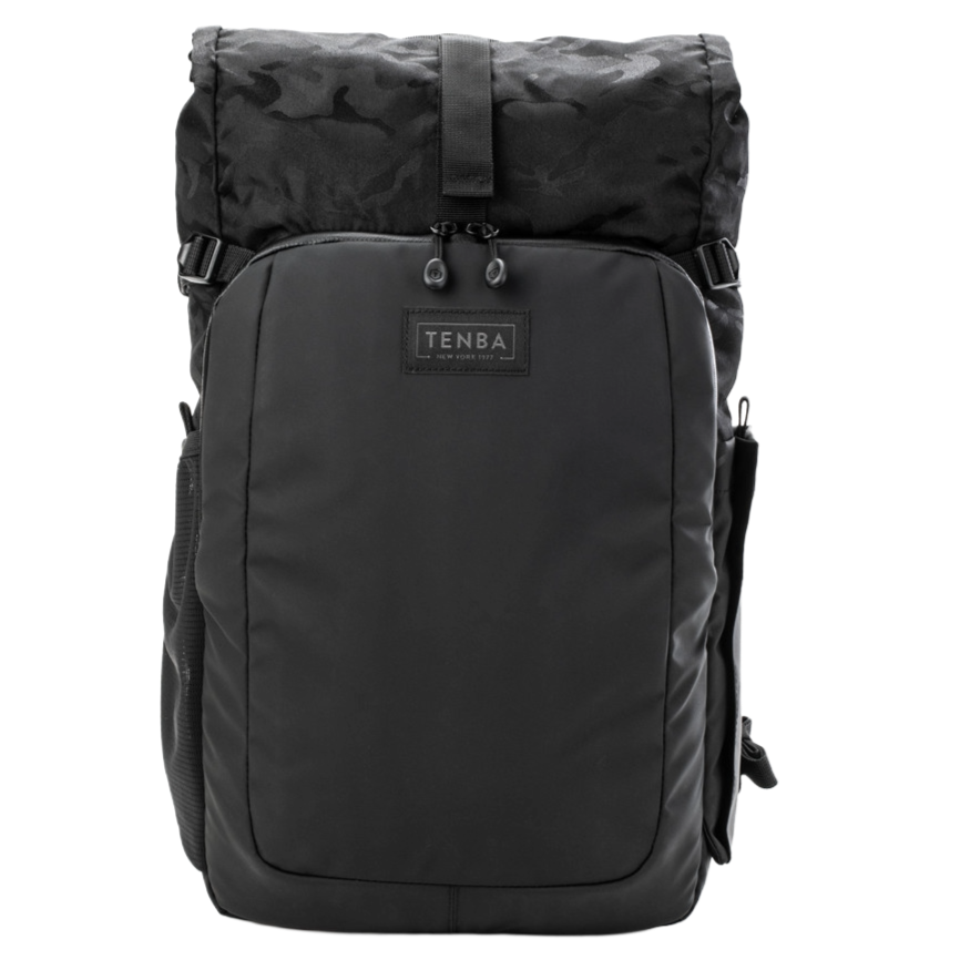 Black TENBA backpack with multiple compartments and a flap top, designed for carrying gear, with a handle on the side.