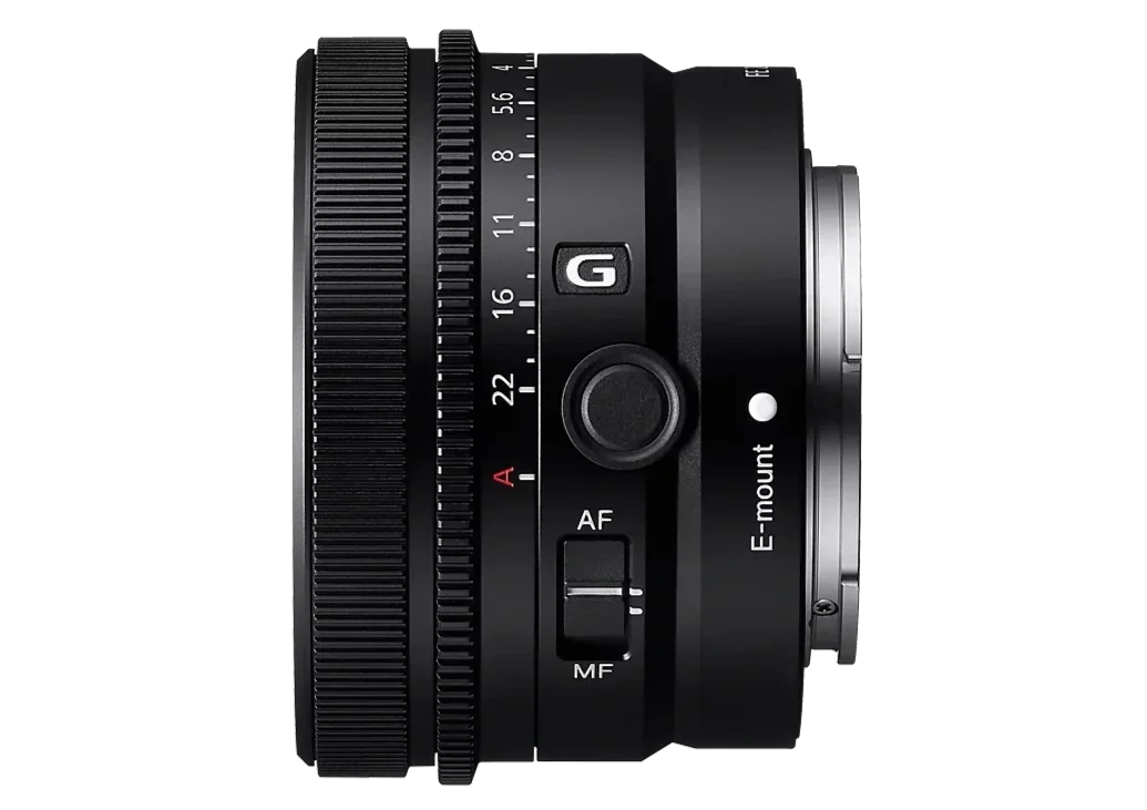 A camera lens with various focus and aperture controls, mounted on a black background.