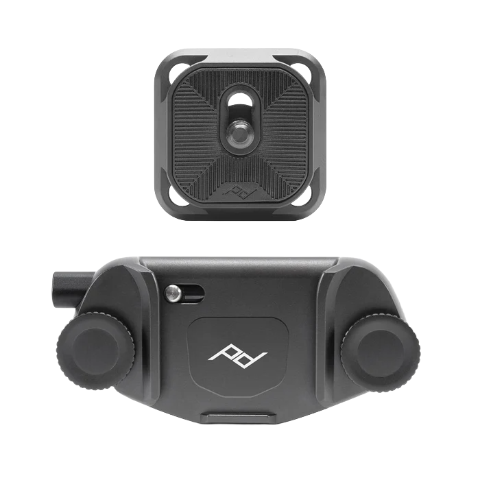 A black and gray camera mount system with a square camera module above a dual-arm mounting bracket with knobs for adjustments.