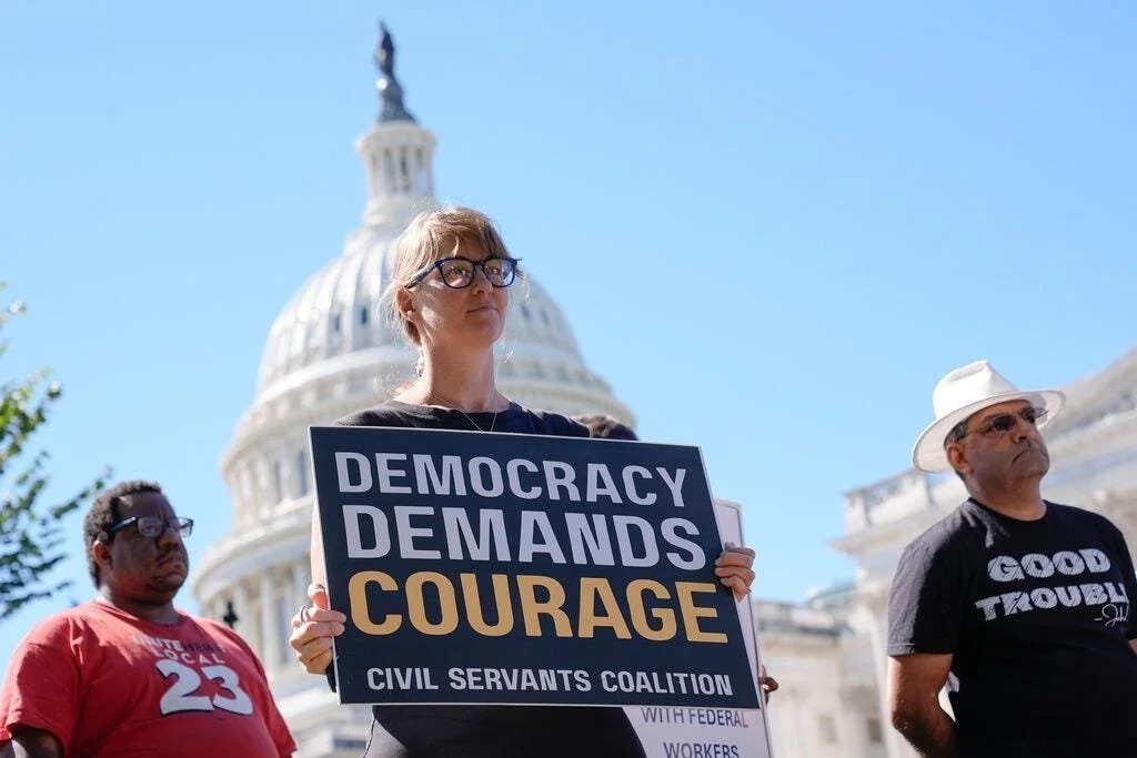 Jenna Norton stands in front of the Capitol as a furloughed federal worker on the first day of the shutdown (credit: NBC)