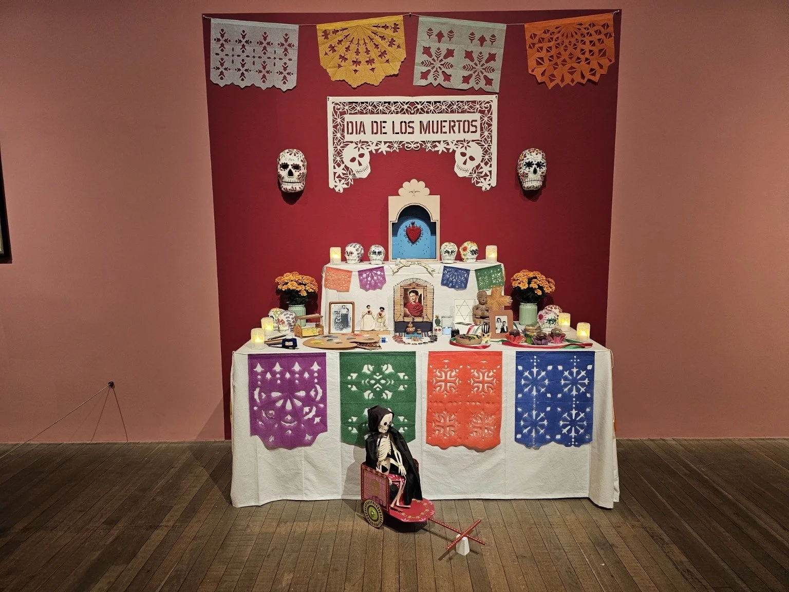 A colourful Día de los Muertos altar display at the Frida Kahlo exhibition.