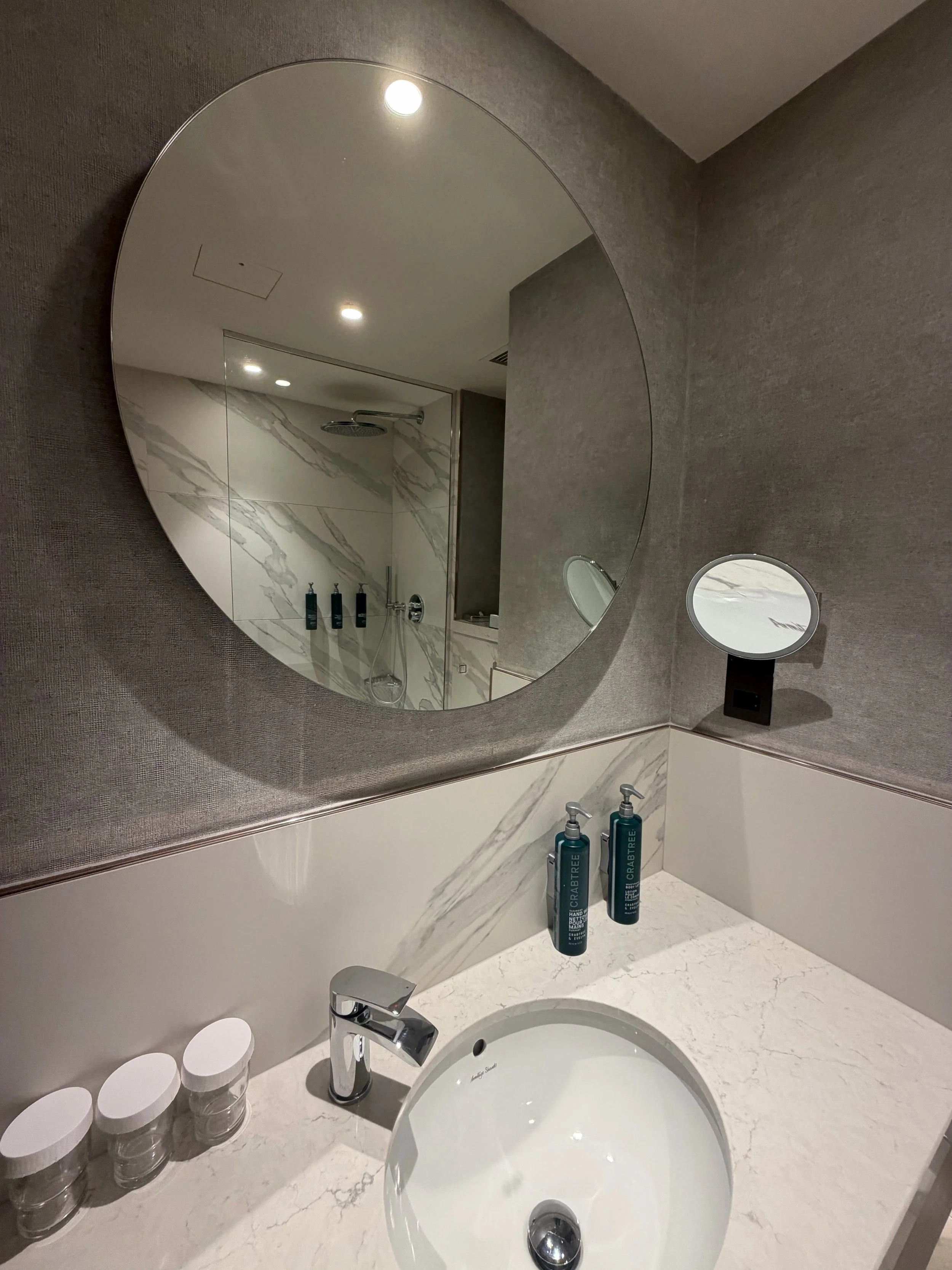 Hilton Dublin bathroom basin and round mirror