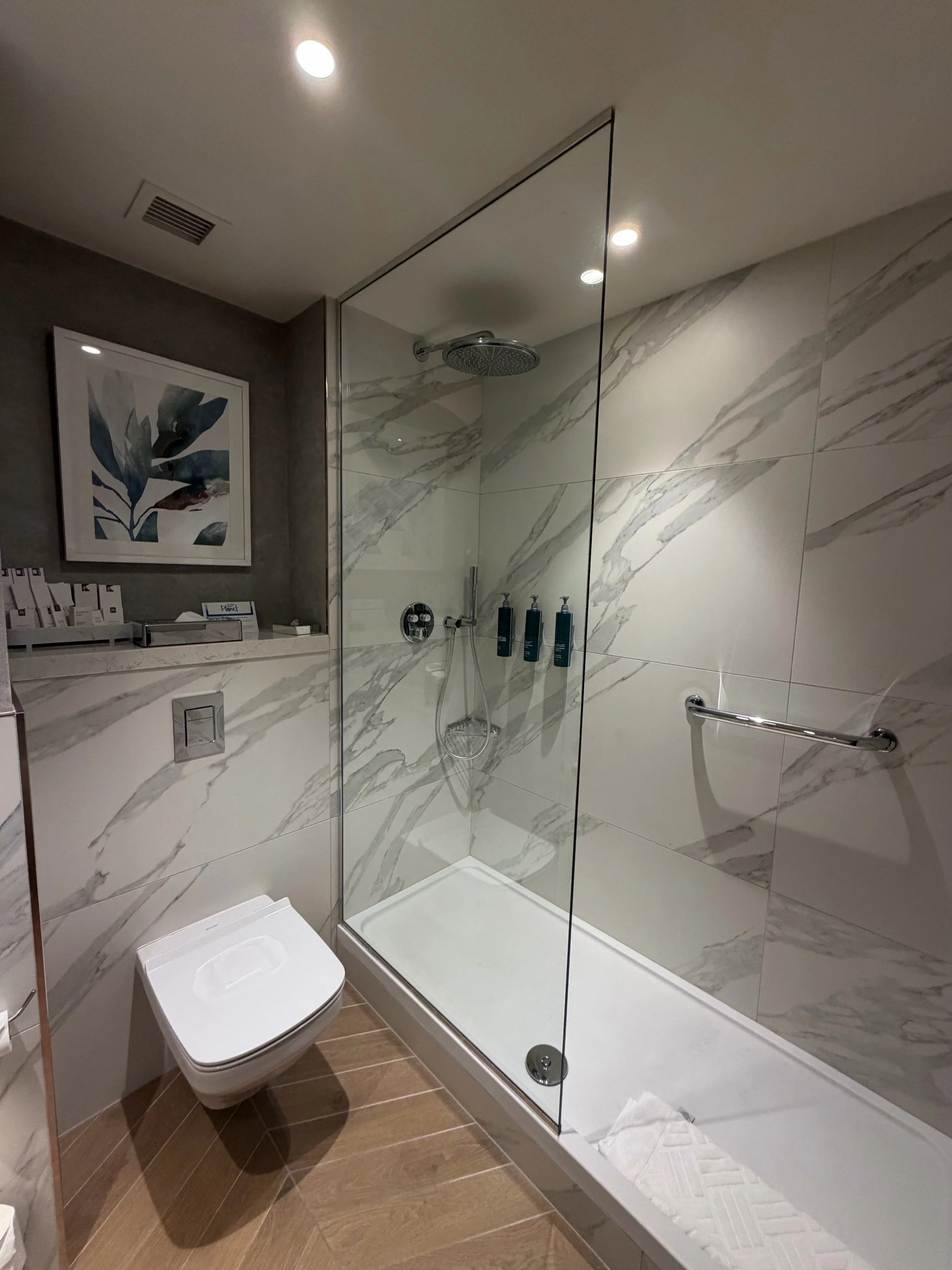 Hilton Dublin marble bathroom with walk-in shower