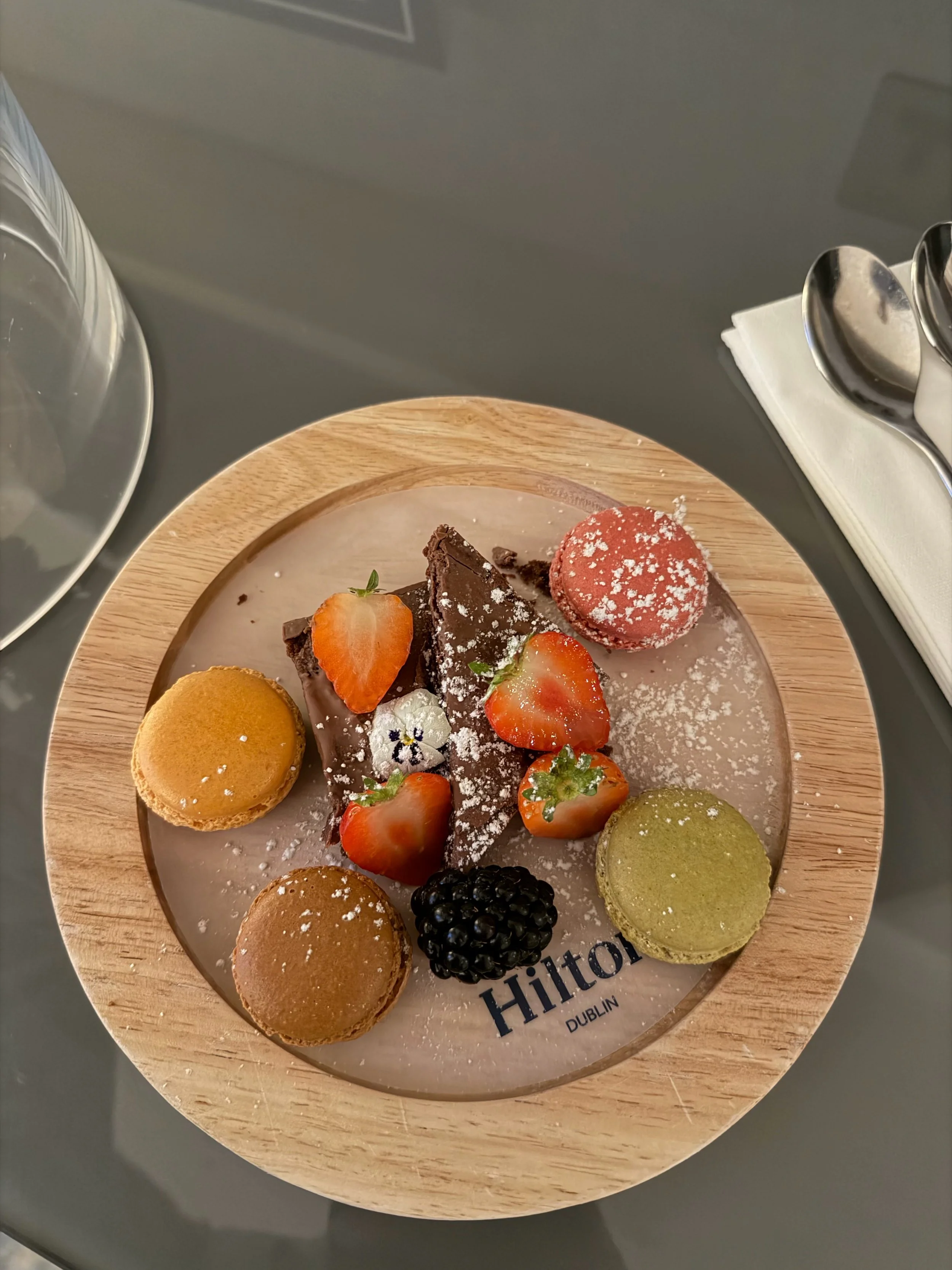 Hilton Dublin welcome plate of macarons, strawberries and chocolate