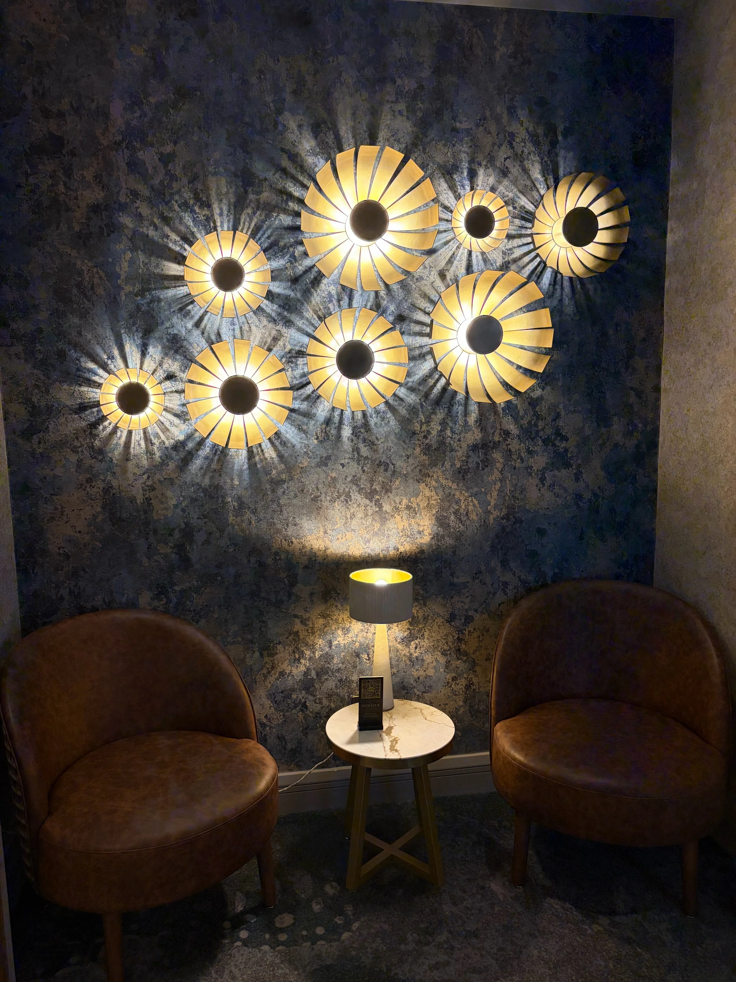 Hilton Dublin seating nook with sunburst wall lights