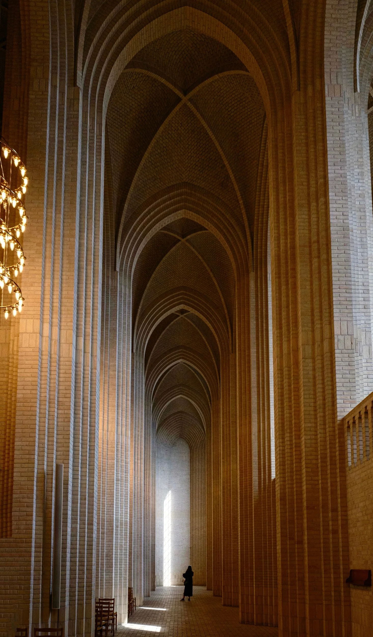 Grundtvig's Church in Copenhagen, a pale brick aisle of tall pointed arches.