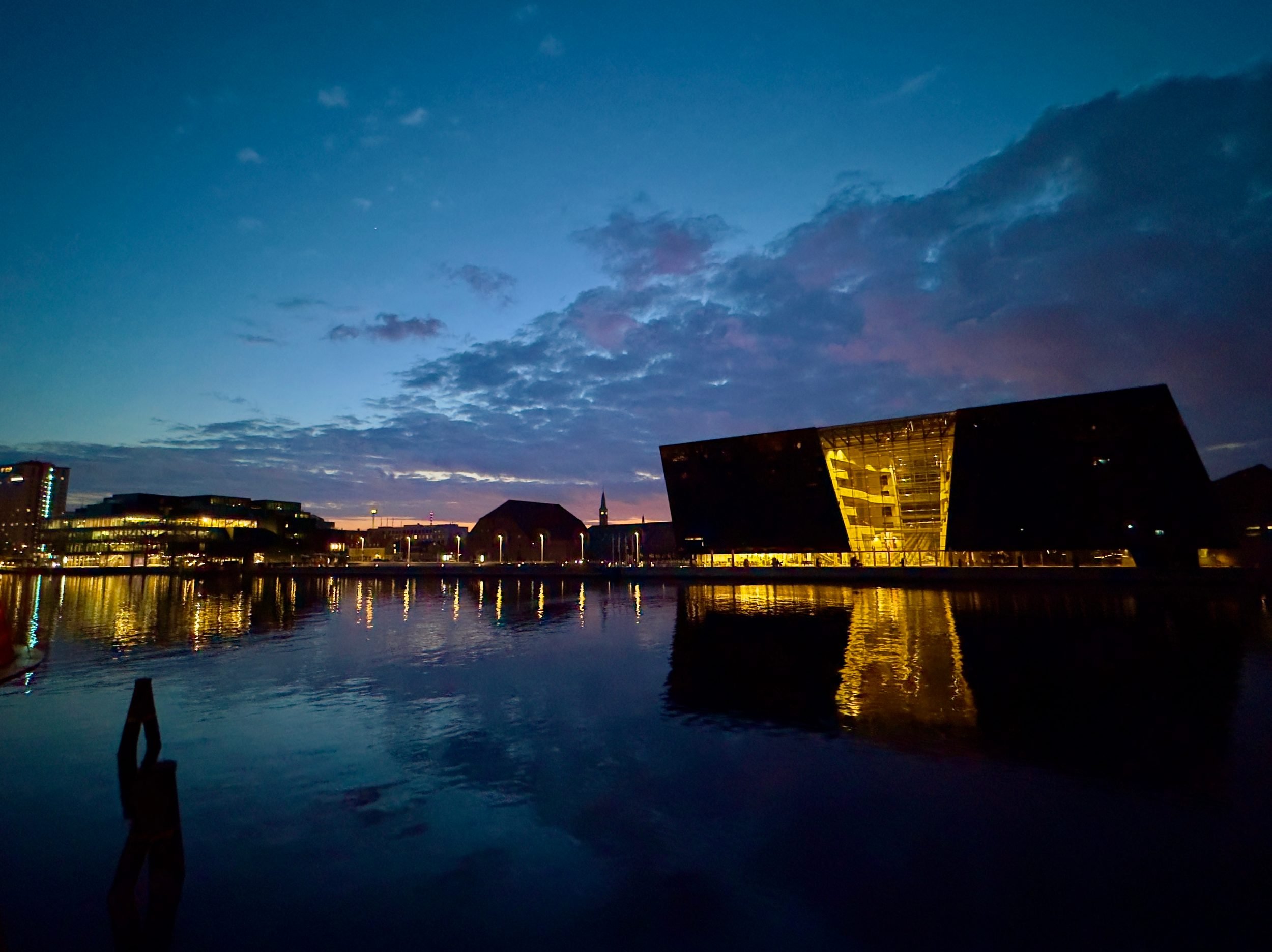 The Black Diamond library's dark glass façade on Copenhagen's harbour.