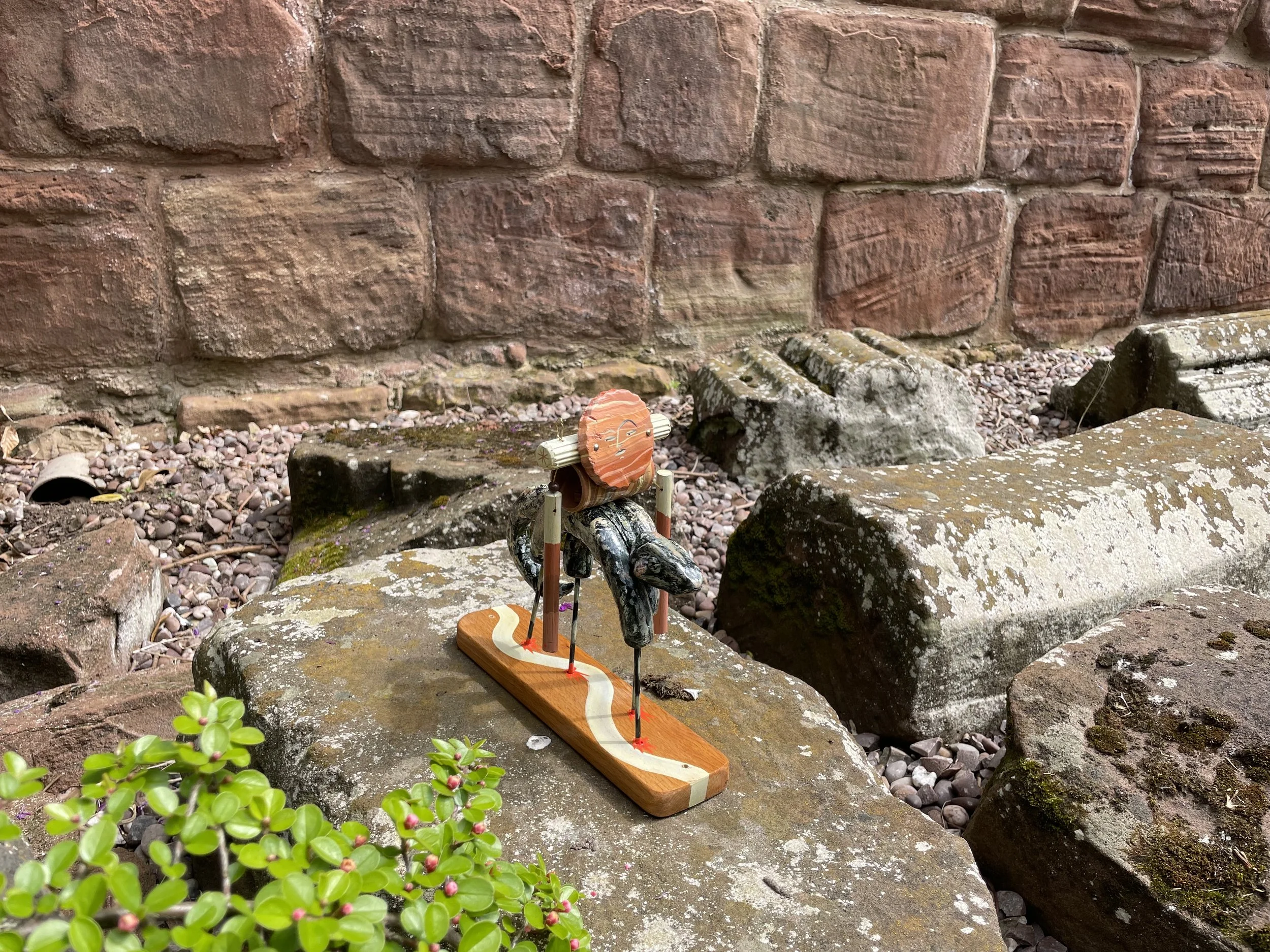 'SANDSTONE WALKS WITH ANCIENT FRIENDS' Sandstone is perched upon the back of a Chrirotherium as they walk among the ruins.  Fossilised footprints on display in the undercroft museum suggest the slow passage of time.  Stories of all who have gone befo