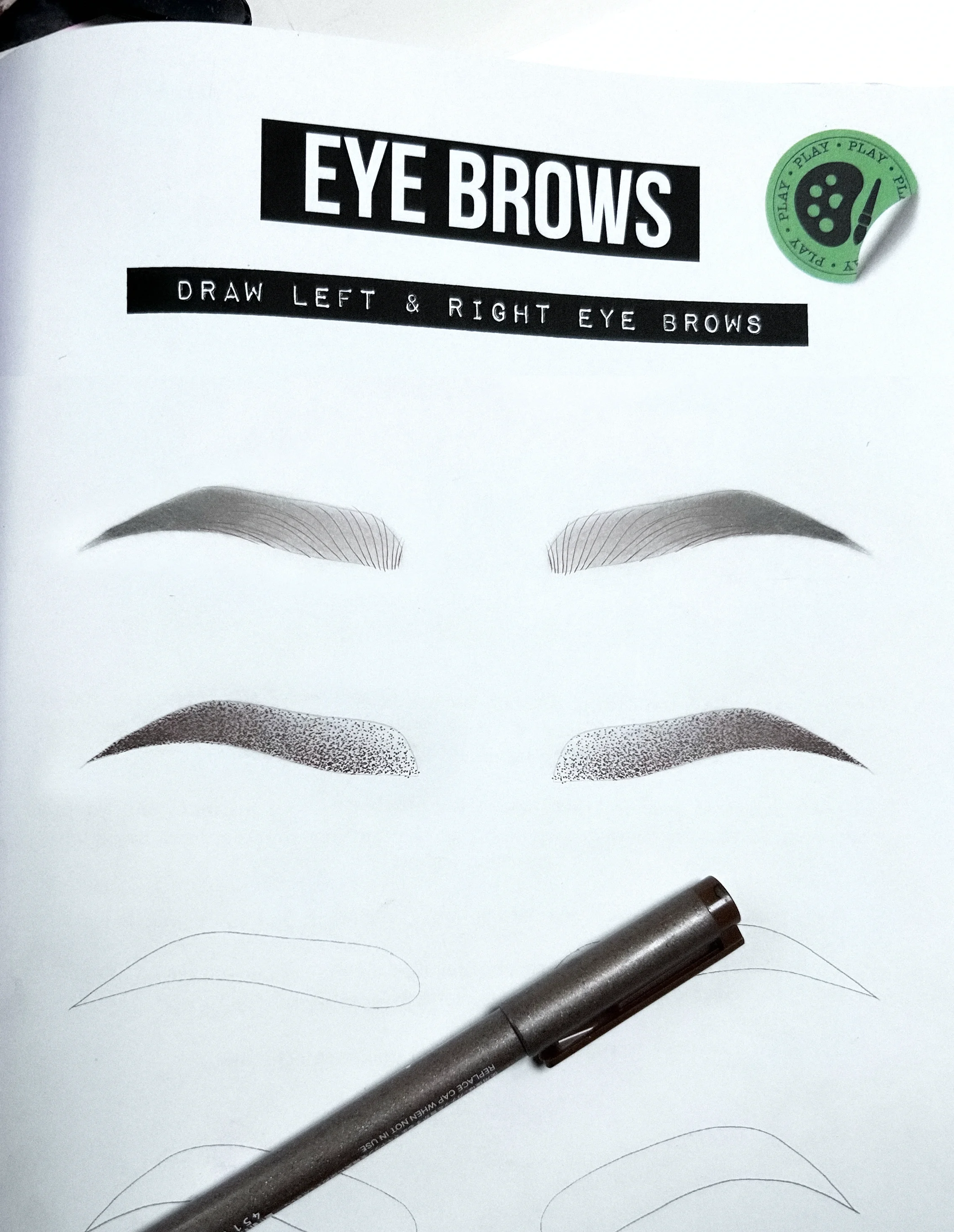 Practicing left and right eyebrow symmetry on paper before PMU machine training.