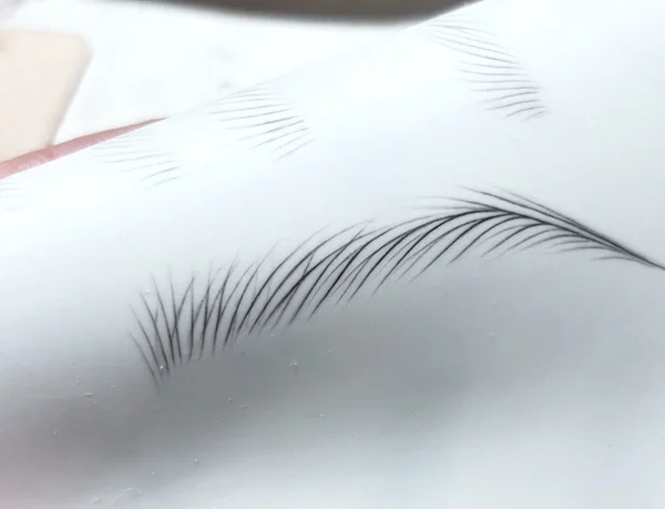 Close-up of eyebrow stroke flow practice focusing on rhythm and consistency.