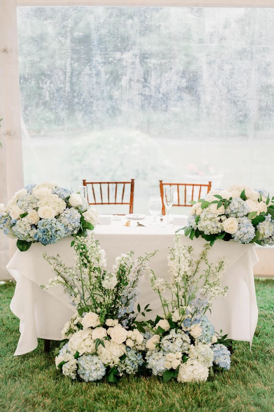 Wedding sweetheart table with floral centerpiece