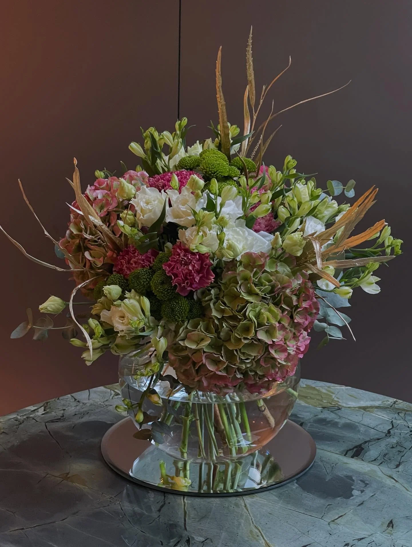 Botanical Beauty, Bespoke for the Season

A hand-crafted bouquet in our signature botanical style, featuring cloud-soft Hydrangeas, elegant Eustoma, textured Dianthus and touches of festive gold foliage for a subtle, luxurious glow. Designed to feel 