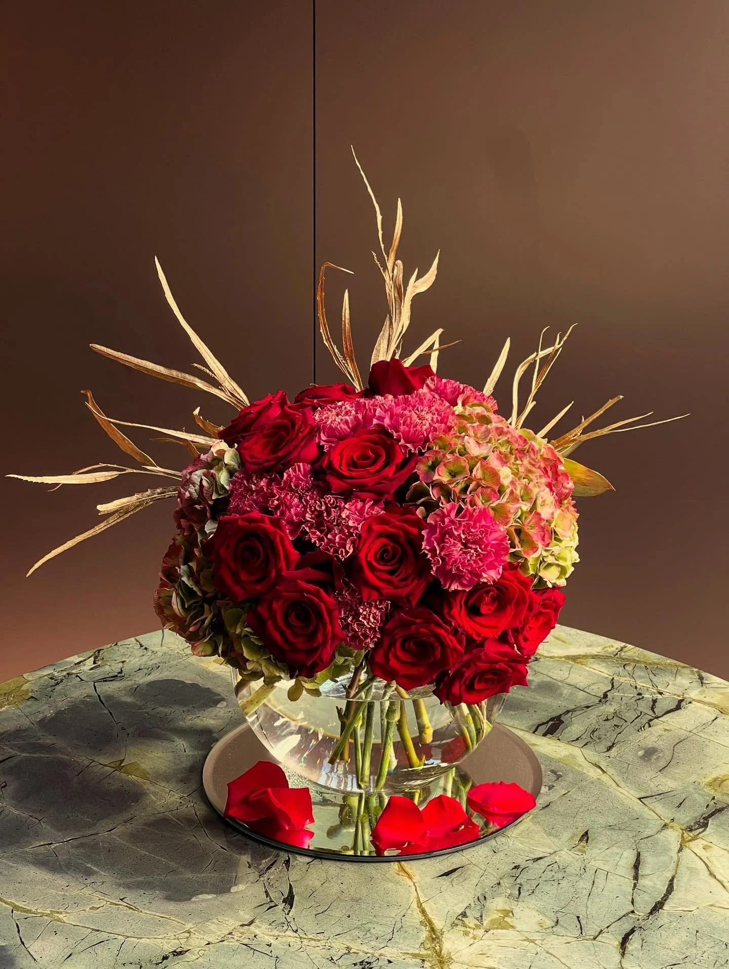 Introducing the St-ROSE Golden Blush Bouquet - An ode to festive elegance, where soft romance meets seasonal opulence.

Part of our Christmas Collection, this couture arrangement blends Blush Hydrangeas, Vintage Pink Dianthus, and Velvety Red Roses, 