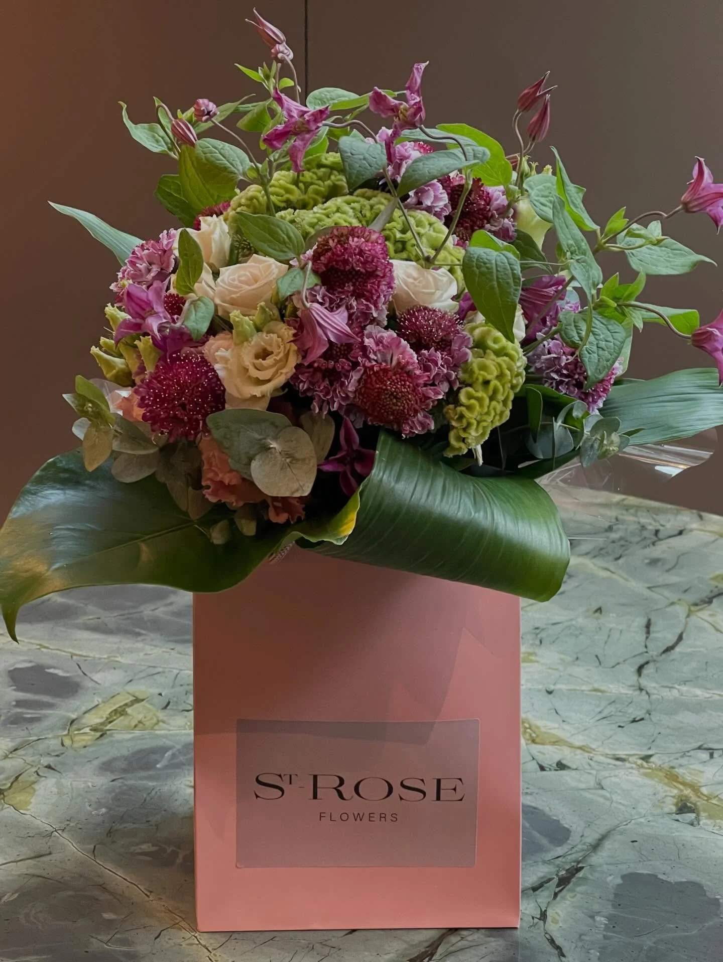 Texture, tone and beauty. 
Airy Scabiosa, dramatic Celosia, Clematis, Lisianthus and Roses. Finished with deep Tropical Greens for a bold, natural look.

#floraldesign #bouquet #luxuryflowers #texturalflorals #modernflorals #editorialflowers #flowers