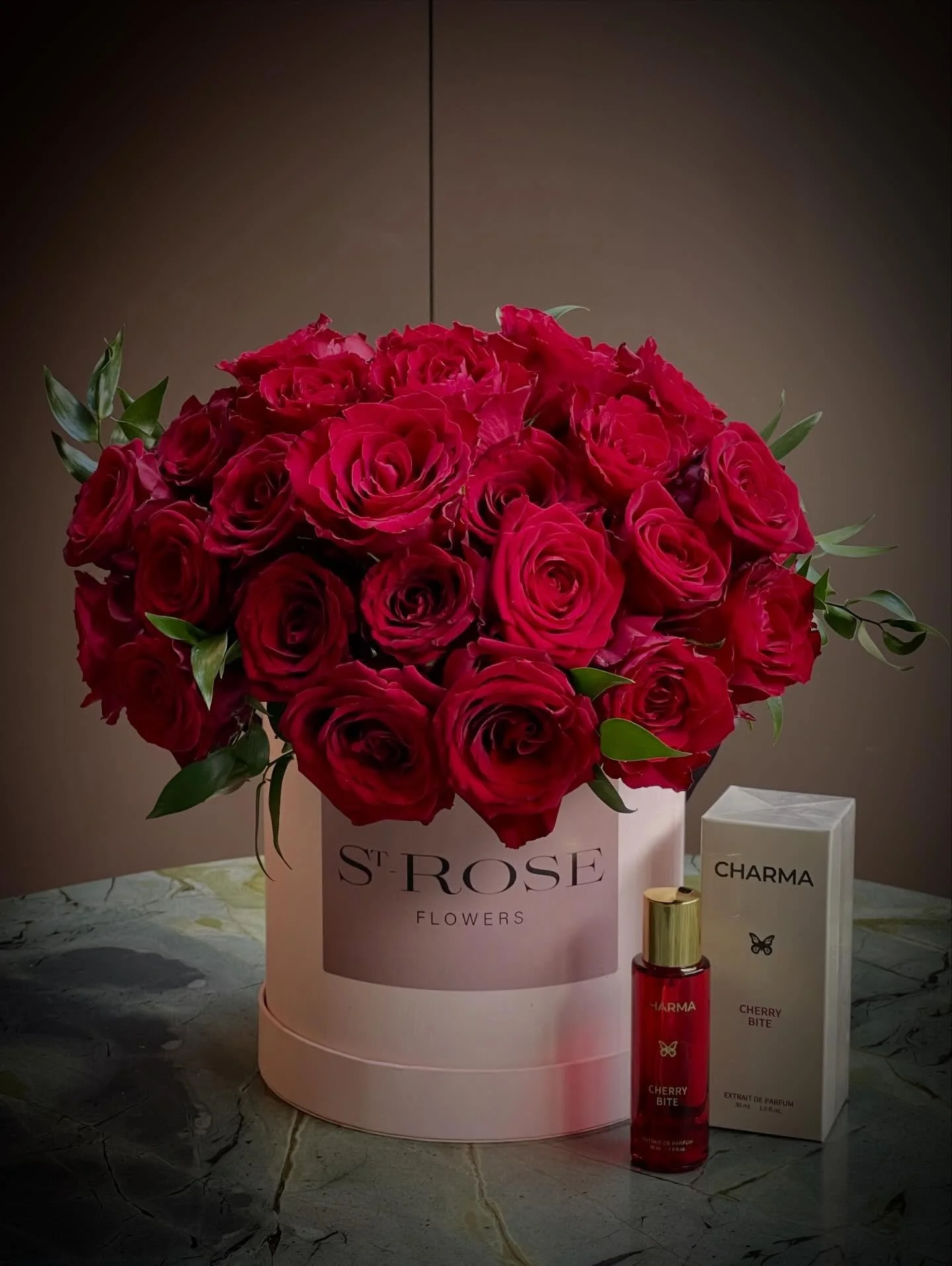 An exclusive Limited Edition collaboration.

St-ROSE Flowers &times; Charma Fragrance.

Thirty velvety red roses, sculpted in our signature dome, paired with Charma Fragrance Cherry Bite &mdash; a scent layered with notes of Sour Cherry, Jasmine Samb