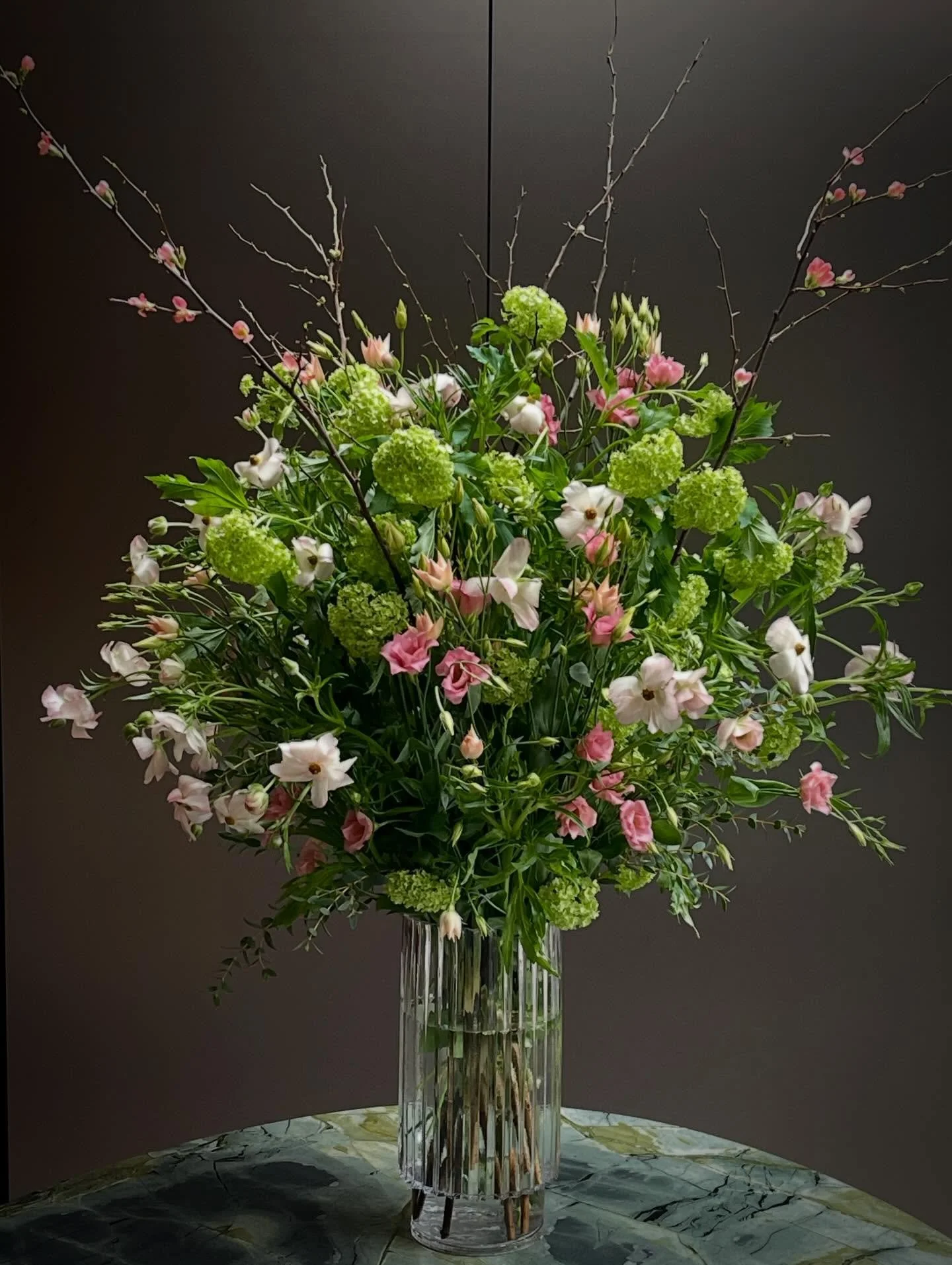 Peach perfection in blooms.

A sculptural tower of Peach Blooms, Viburnum, Butterfly Ranunculus, Eustoma and trailing Eucalyptus &mdash; soft, modern and effortlessly elegant.

By St-ROSE Flowers.

#StRoseFlowers #EditorialFlorals #LuxuryFlorals #Flo