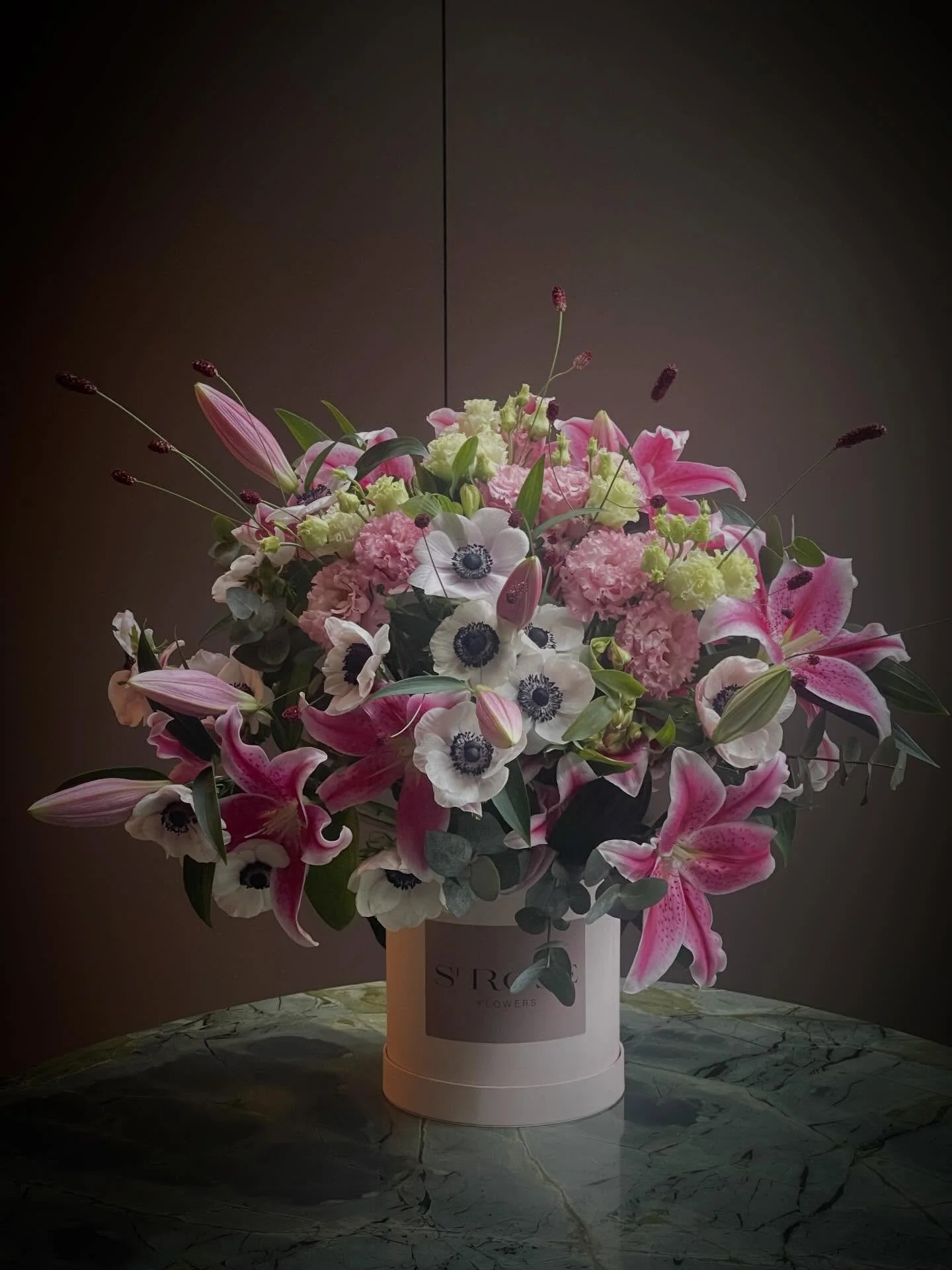 St-ROSE Flowers Lillies Study.

A luxurious arrangement defined by quiet confidence.

Oriental Lilies are in full expression,
Anemones hold their quite depth,
Eustoma drifts in softness and Red Dreams trace whimsical lines. 

#StROSEFlowers #FloralCo