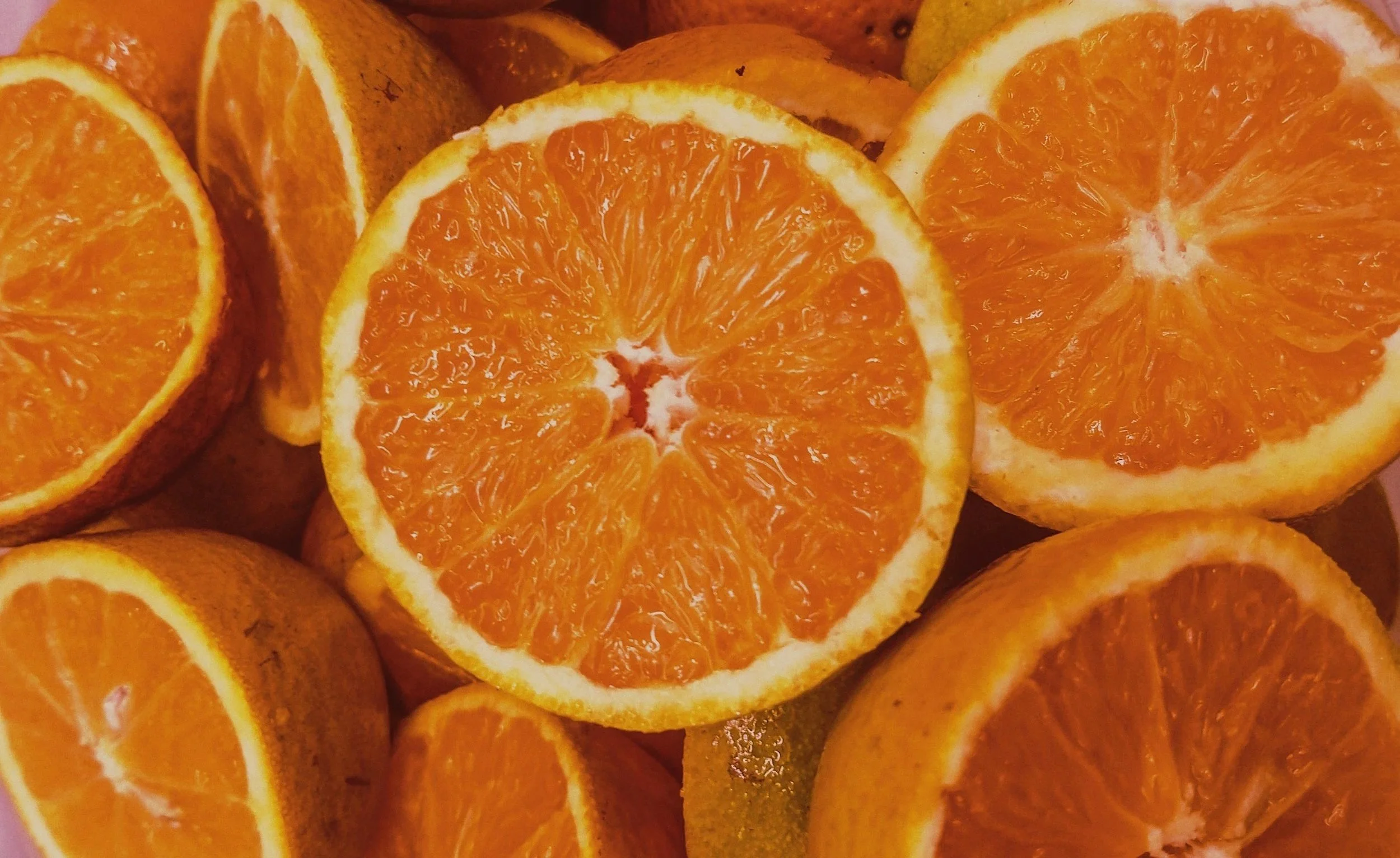 Close up of oranges cut in half and grouped together