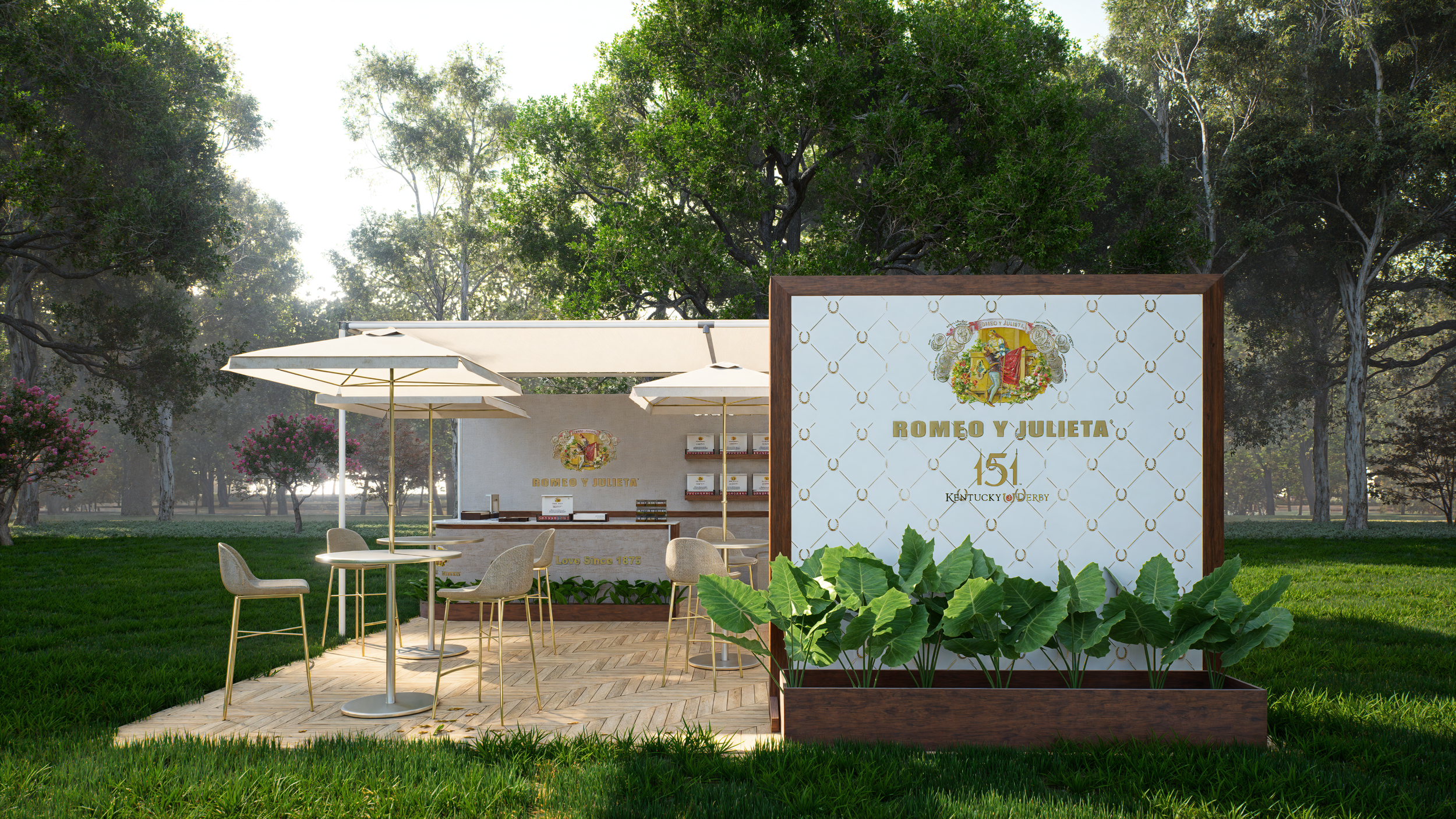 Outdoor seating area in a park with a white bar counter, umbrella-shaded tables, and chairs, surrounded by green trees and plants, featuring signage that reads "Romeo y Julieta 151 Kentucky Derby".