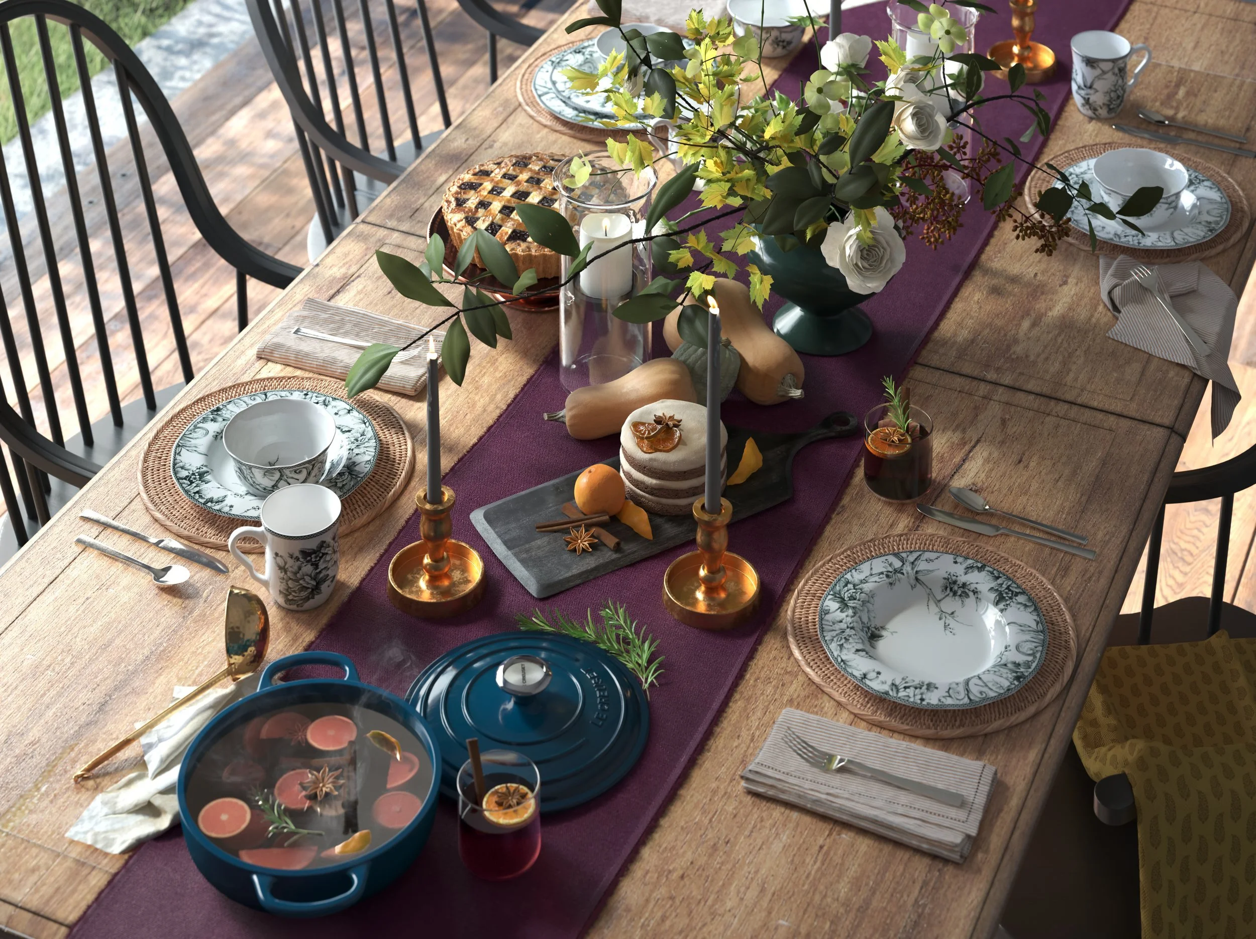 A wooden dining table set with a purple table runner, floral centerpiece, candles, plates, mugs, cutlery, and a cast iron skillet with a drink, surrounded by black chairs.