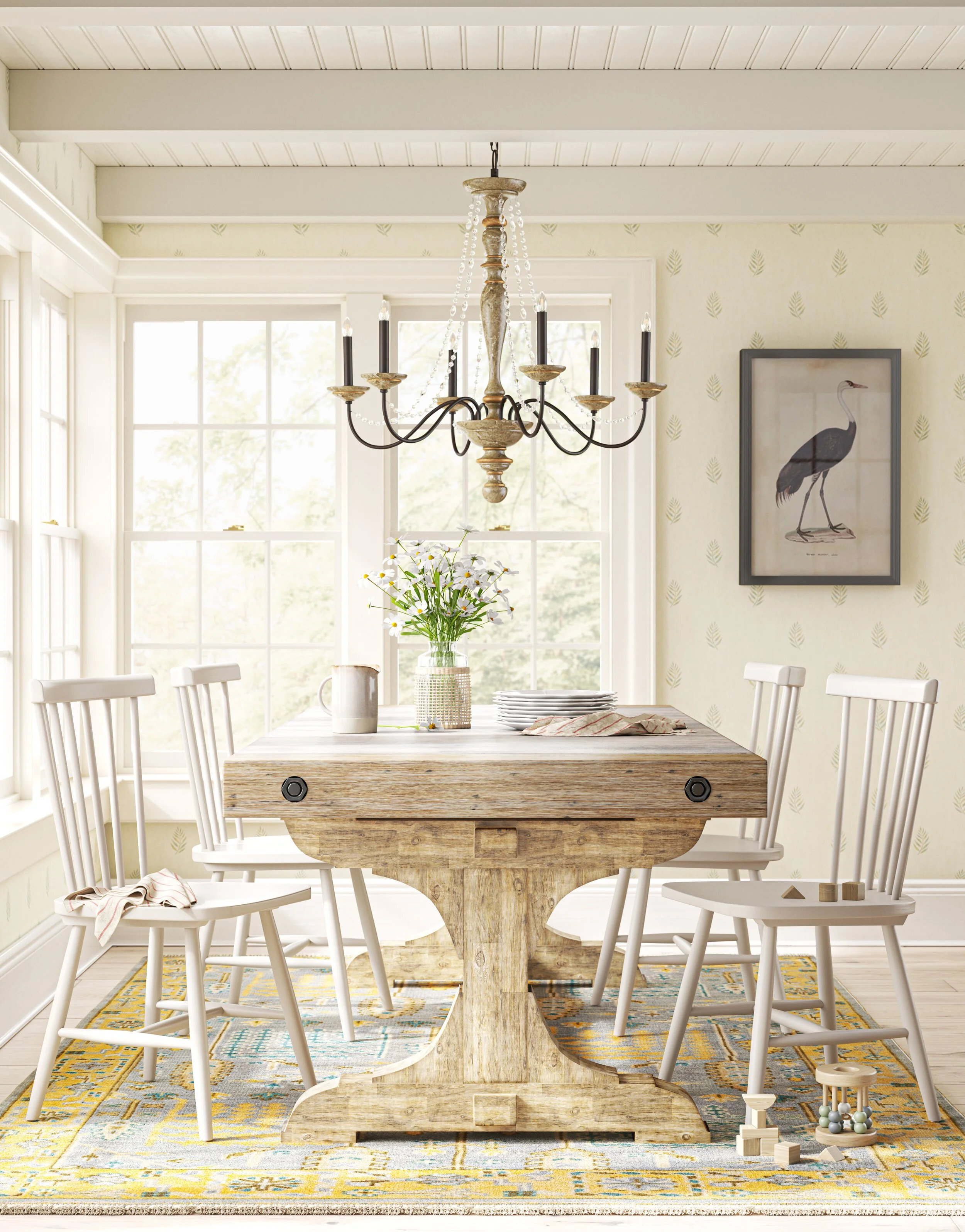 A bright dining room with a rustic wooden table and six white chairs. On the table, there is a vase with flowers, some plates, a pitcher, and a cloth. A chandelier hangs above the table. Large windows let in natural light, and the walls are decorated