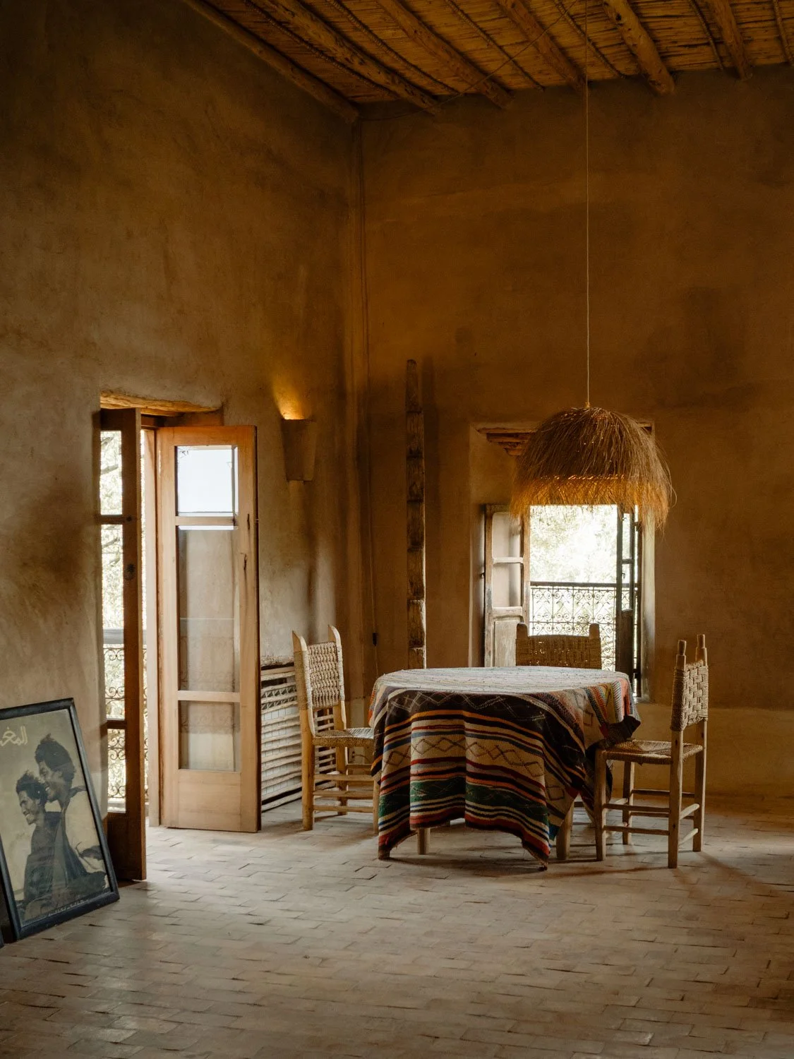 Interior space at Berber Lodge near Marrakech, earthen walls and natural textures in a minimal setting