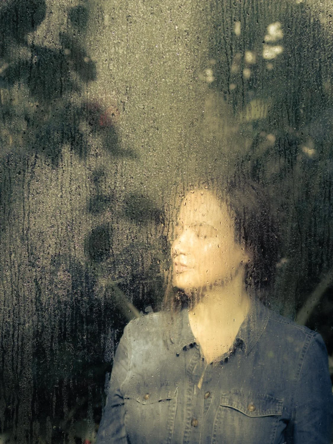 Woman enjoying soft winter light in the Munich Botanic Garden, Munich