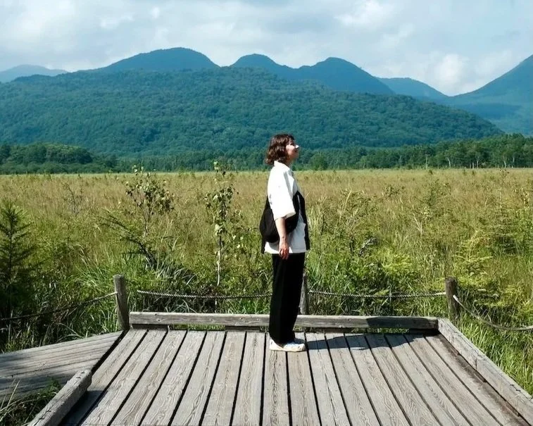 Japan — Inner Japan × Sensory Travel: person standing in nature, looking over a summer landscape