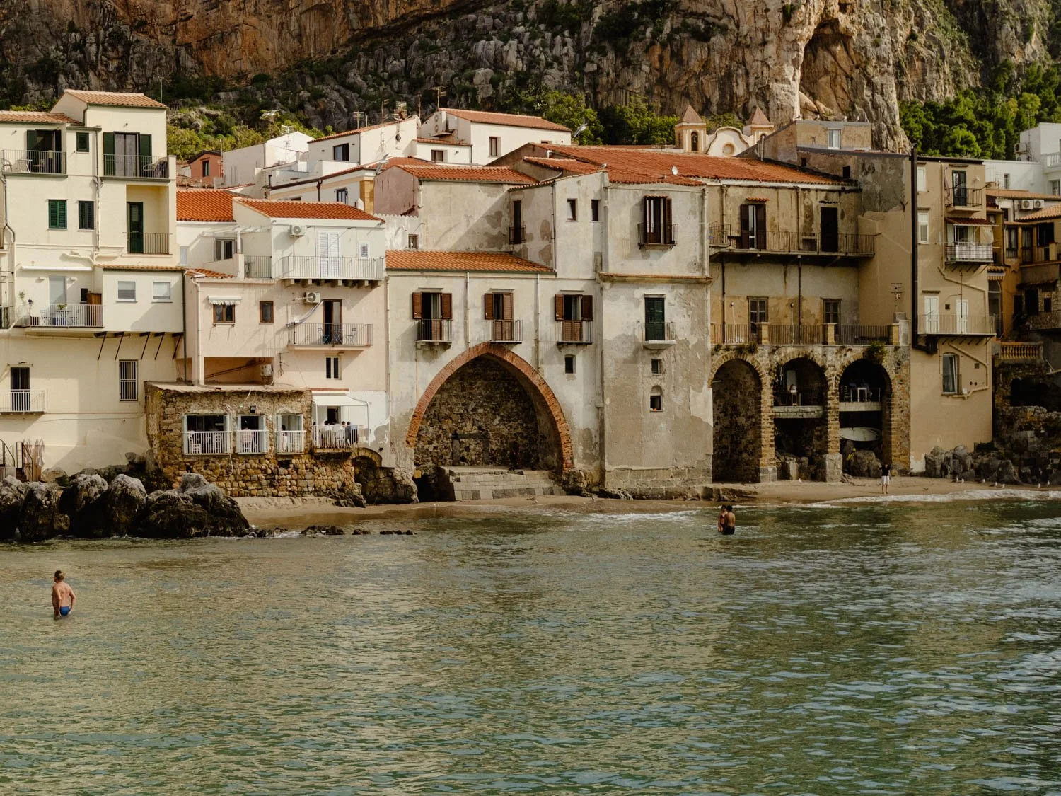 Calm Mediterranean landscape with locals enjoying the sea and the sun