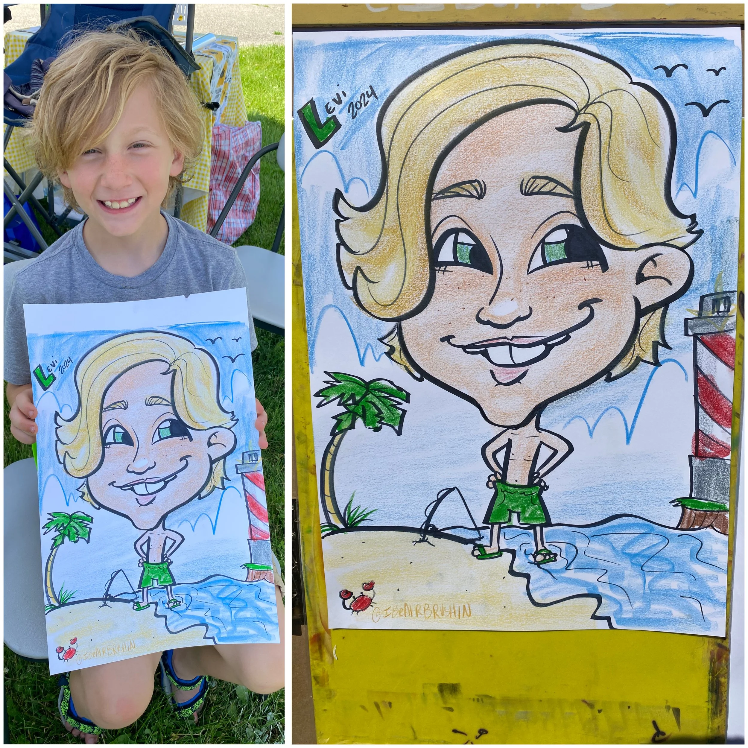 A young boy with blond hair smiling, holding a colorful caricature drawing of himself at an outdoor event. The drawing depicts him on a beach with a palm tree, water, and a lighthouse, with the artist's signature and his name "Levi" written on it.