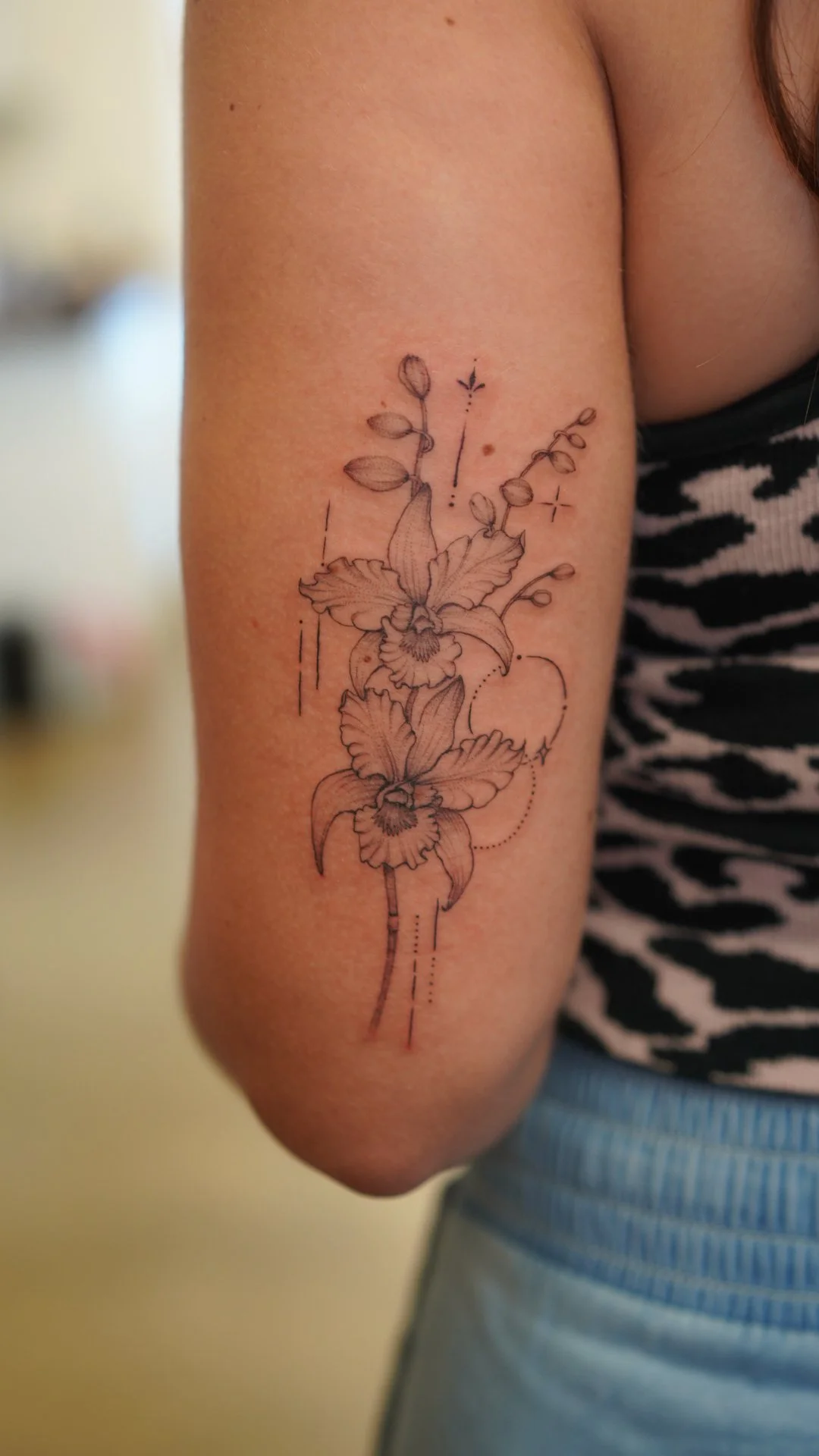 fineline orchid with ornamental flower tattoo.JPG