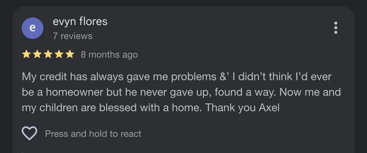 Mountain landscape with snow-capped peaks, green hills, and a modern building.