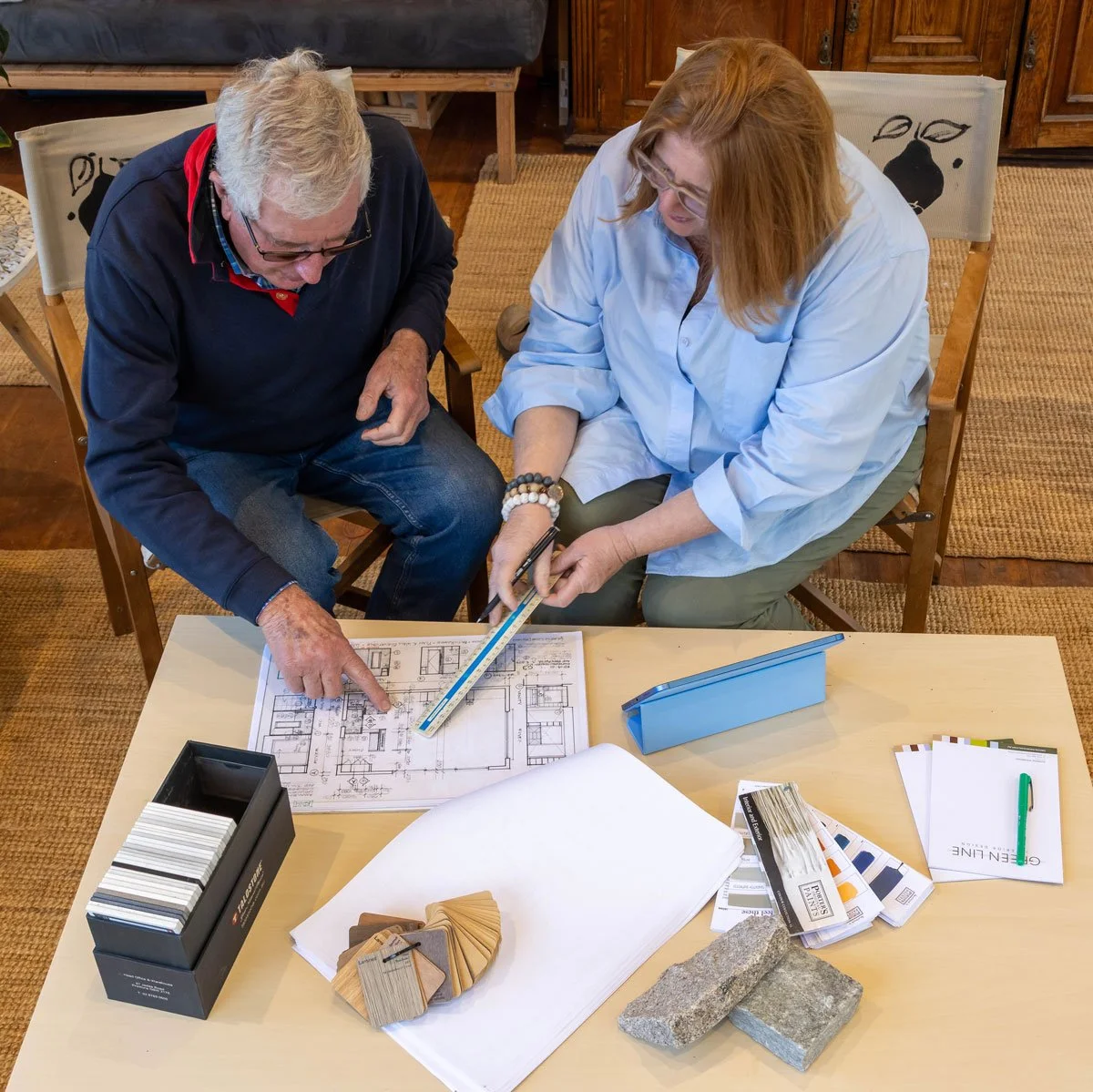 suzie sitting with a client discussing design ideas