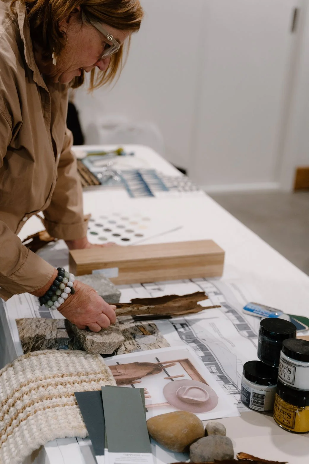 Suzie exploring ideas with a flatlay moodboard