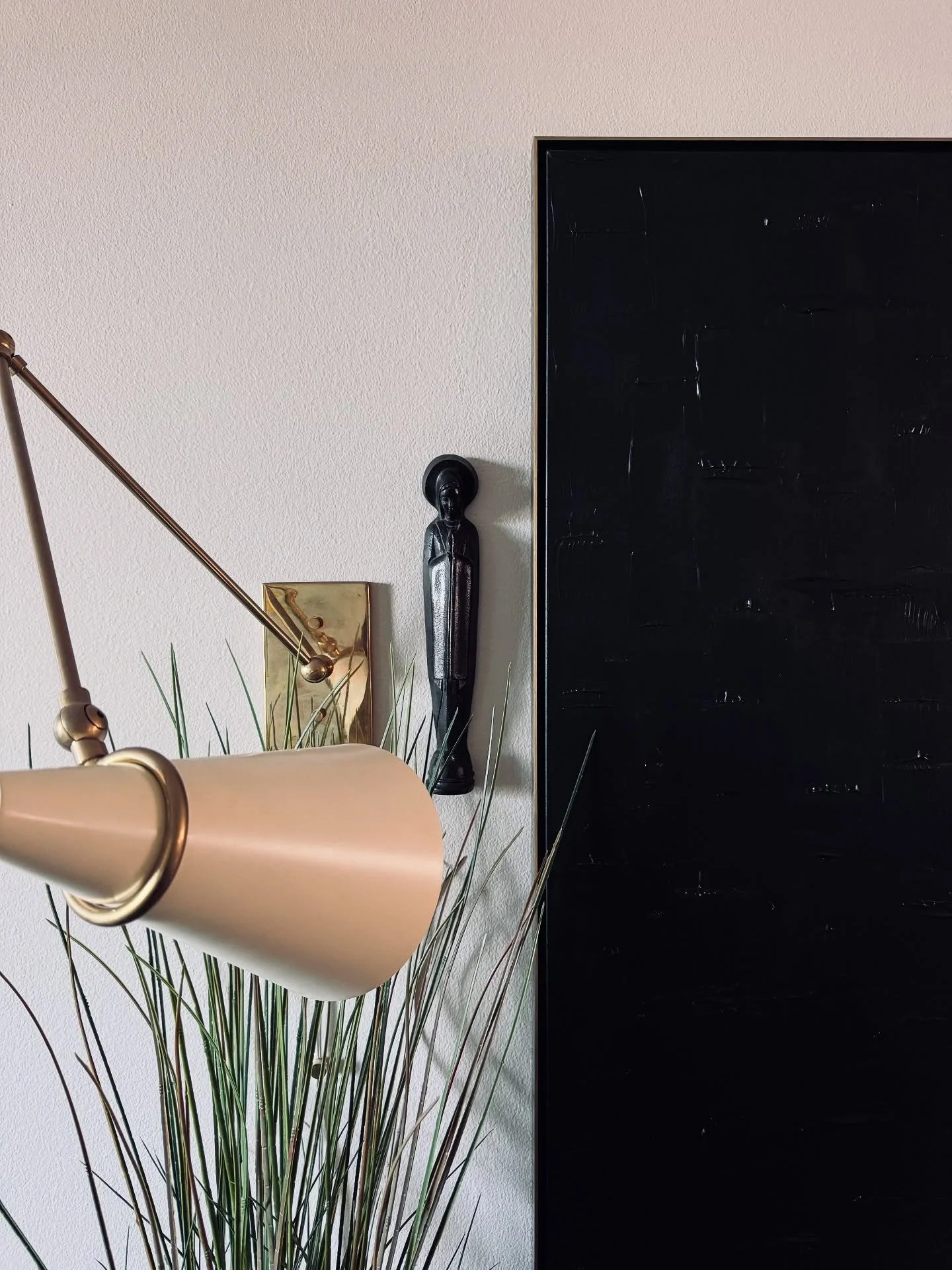 Intentional details make all the difference. Loving the mix of textures here&mdash;warm brass, sculptural wood, and moody black-on-black art. A quiet moment that speaks volumes. 

#HomeDecor #DesignDetails #ModernEclectic #InteriorInspo #CollectedHom