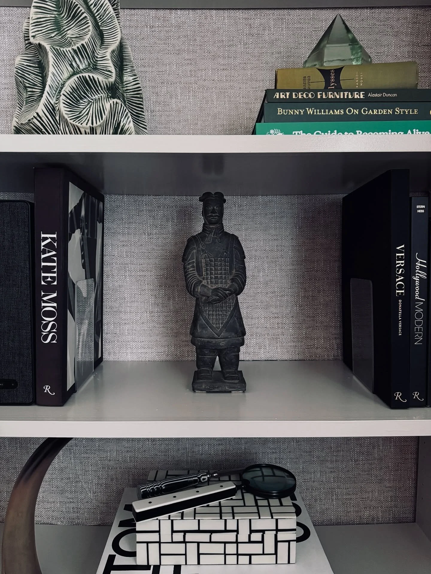 A shelf that tells a story&mdash;where fashion icons meet ancient warriors, and every object earns its place. Curated with contrast, texture, and timeless style in mind. 

#ShelfStyling #CollectedHome #InteriorInspo #ModernMeetsClassic #StyledSpaces