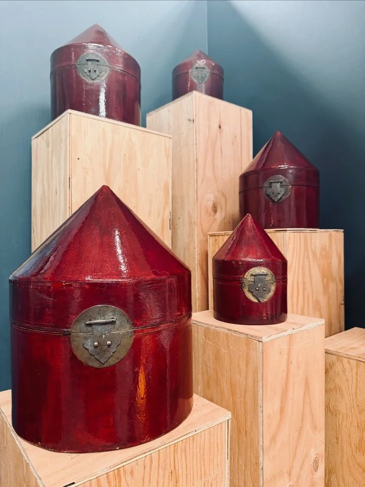 Once used to protect ornate ceremonial hats, these antique Chinese nesting boxes now shine as sculptural d&eacute;cor. Deep red lacquer, aged hardware, and generations of history in every piece. 

Offered as a set of 5. Now available at @urbanamerica