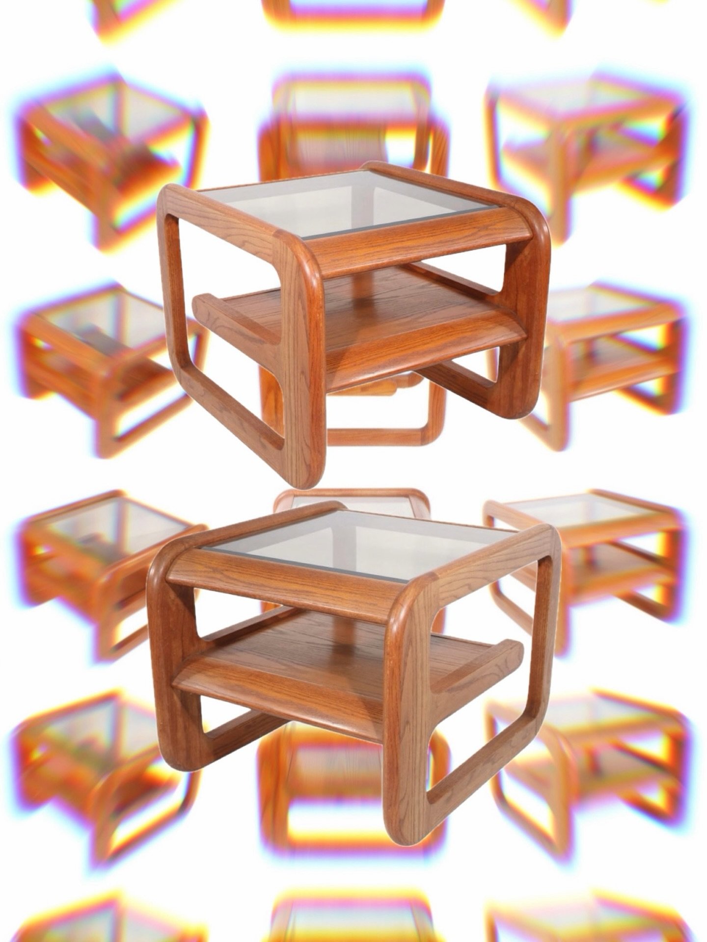 Sculptural yet functional, this pair of vintage Mersman &lsquo;Bellaire&rsquo; side tables exemplifies postmodern design with their bold, continuous forms and rich wood grain. The softened rectangular frames enclose two-tier shelving, creating a rhyt