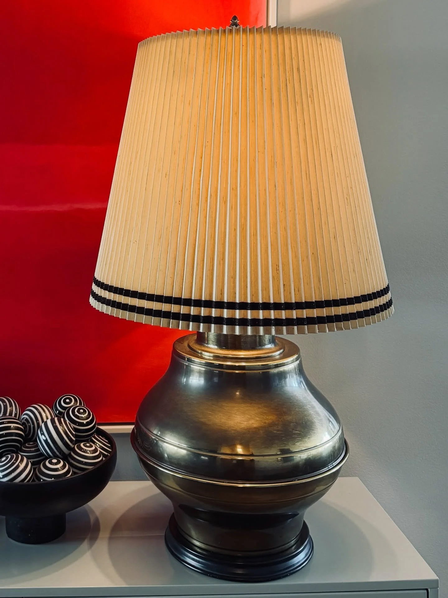 This exceptional &lsquo;Marbro&rsquo; lamp is a striking example of monumental mid-century lighting. Crafted in beautifully polished brass, it features dual bulb sockets and retains its original shade and brass finial, a rare and highly desirable det