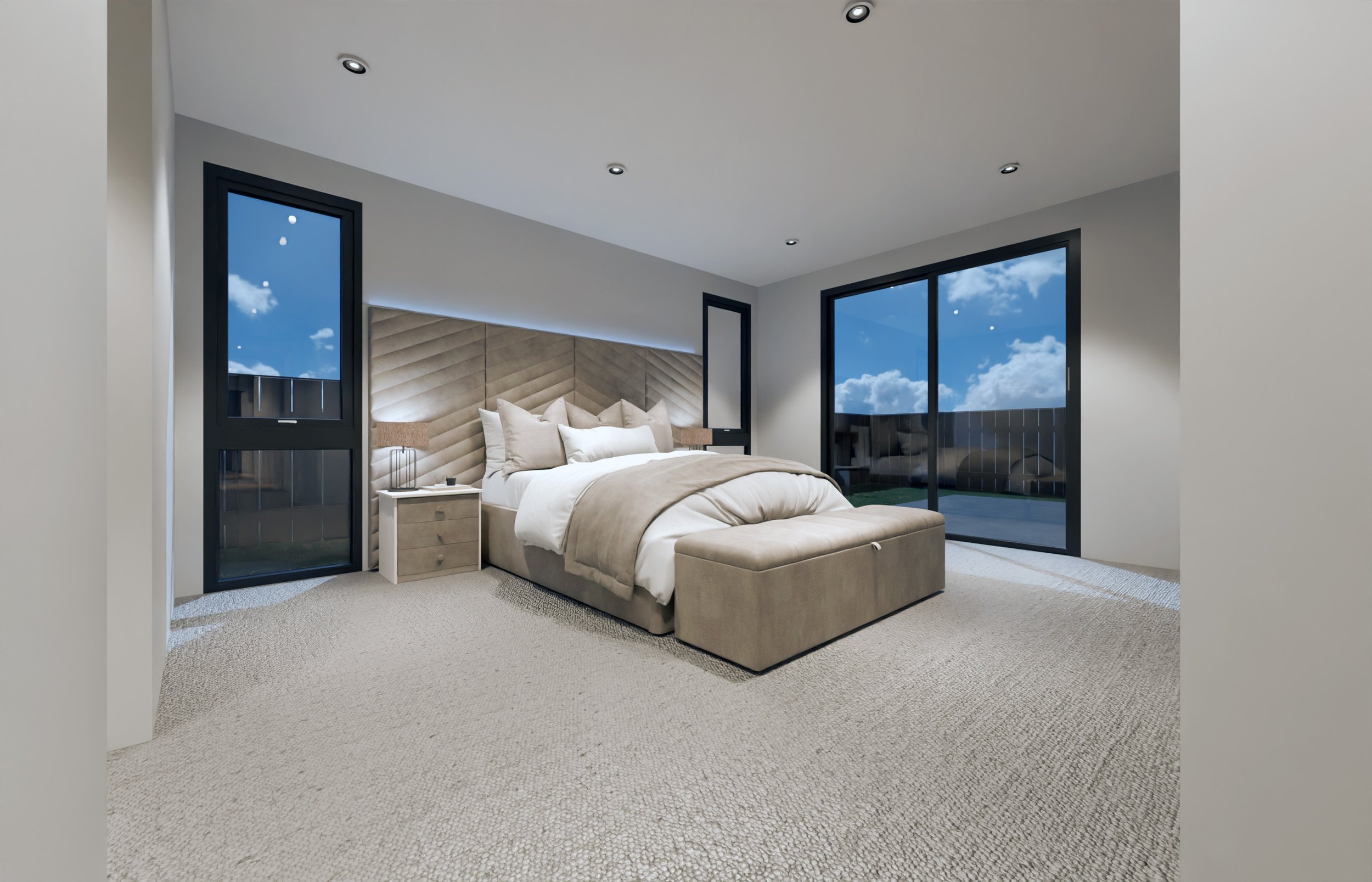 Modern bedroom with beige upholstered bed, large windows showing blue sky and clouds, white and beige bedding, nightstand, and beige ottoman at foot of bed.