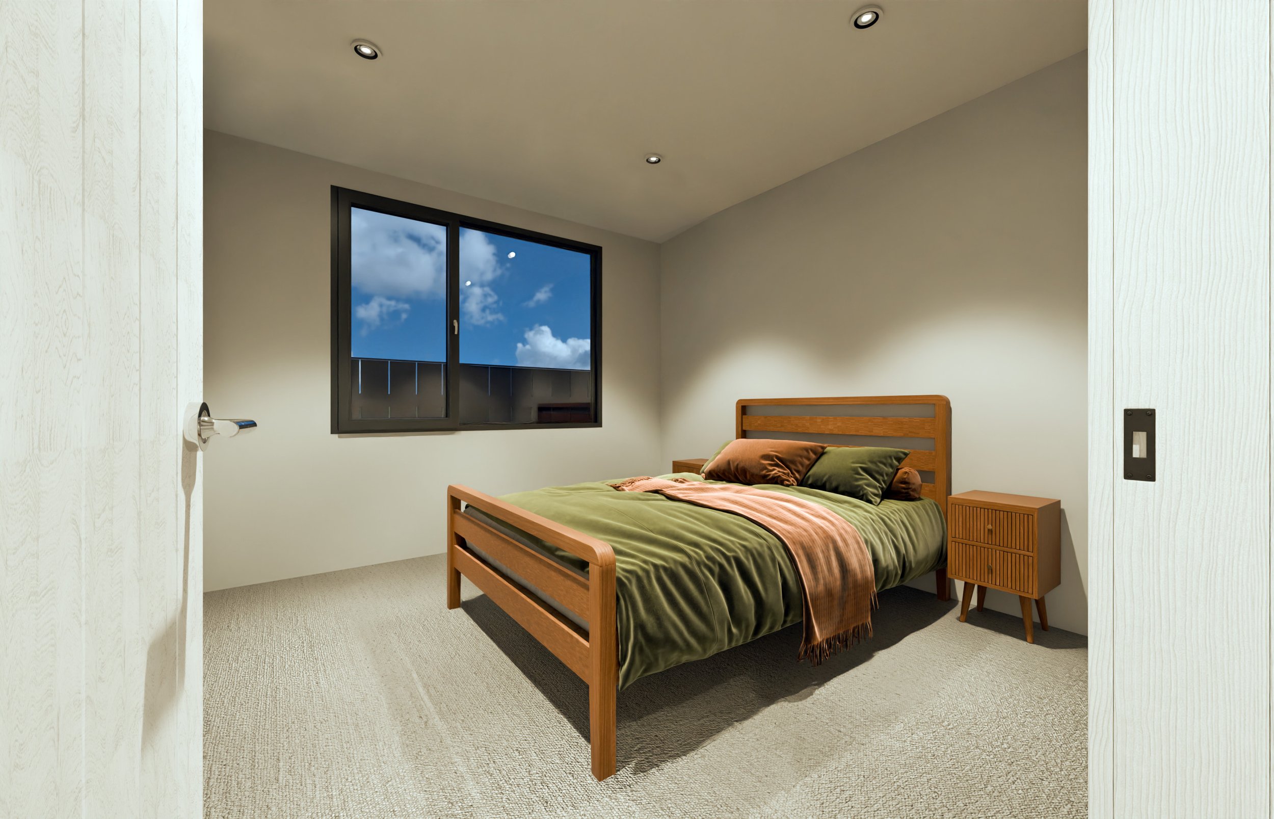 Empty bedroom with a wooden bed with green bedding, a pillow, and a throw, a nightstand, and a window showing the sky with clouds.
