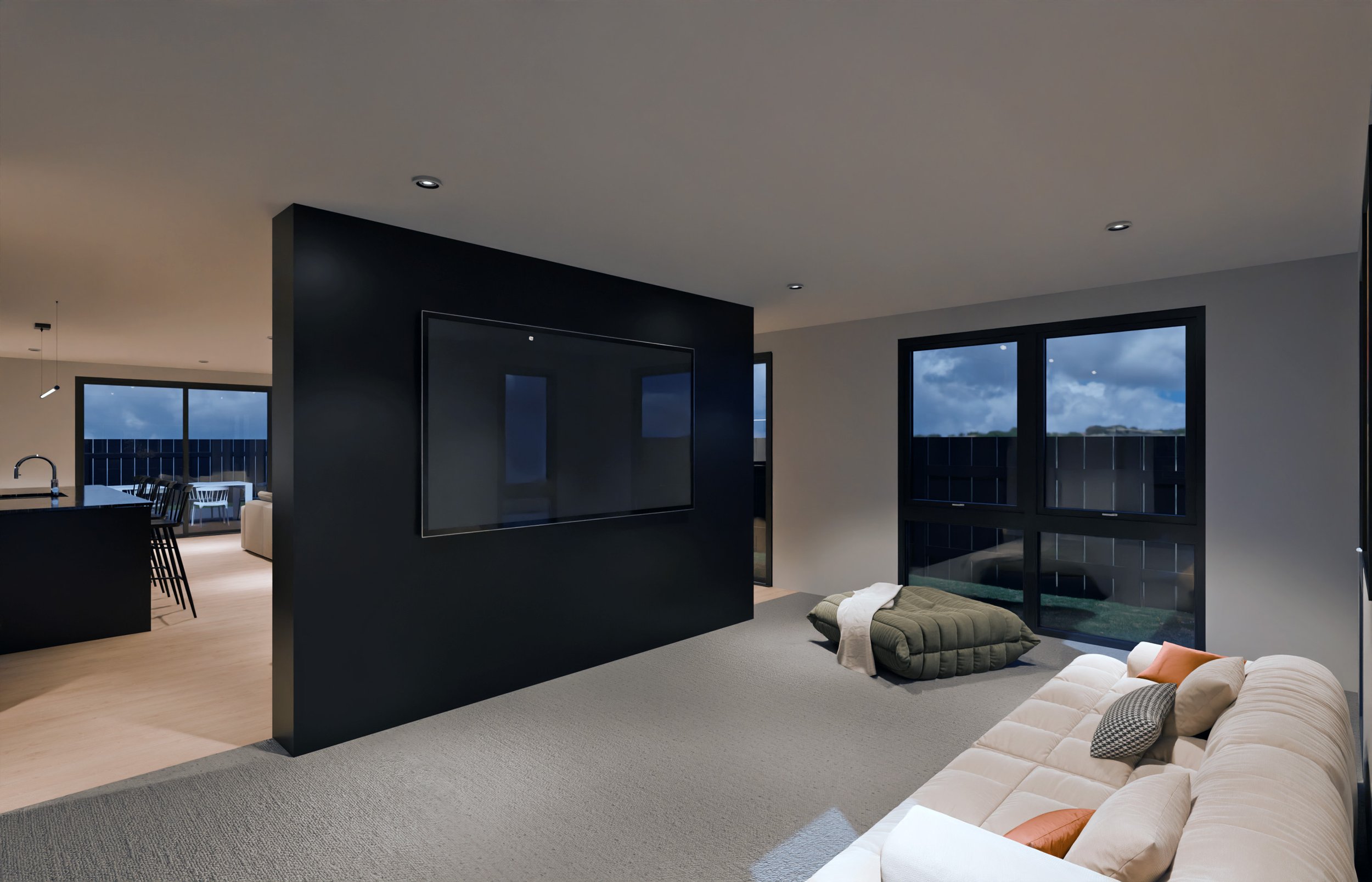 Modern living room with large windows, a beige sofa with cushions, a dark green mattress, and a large wall-mounted TV, with a view of a balcony and cloudy sky outside.