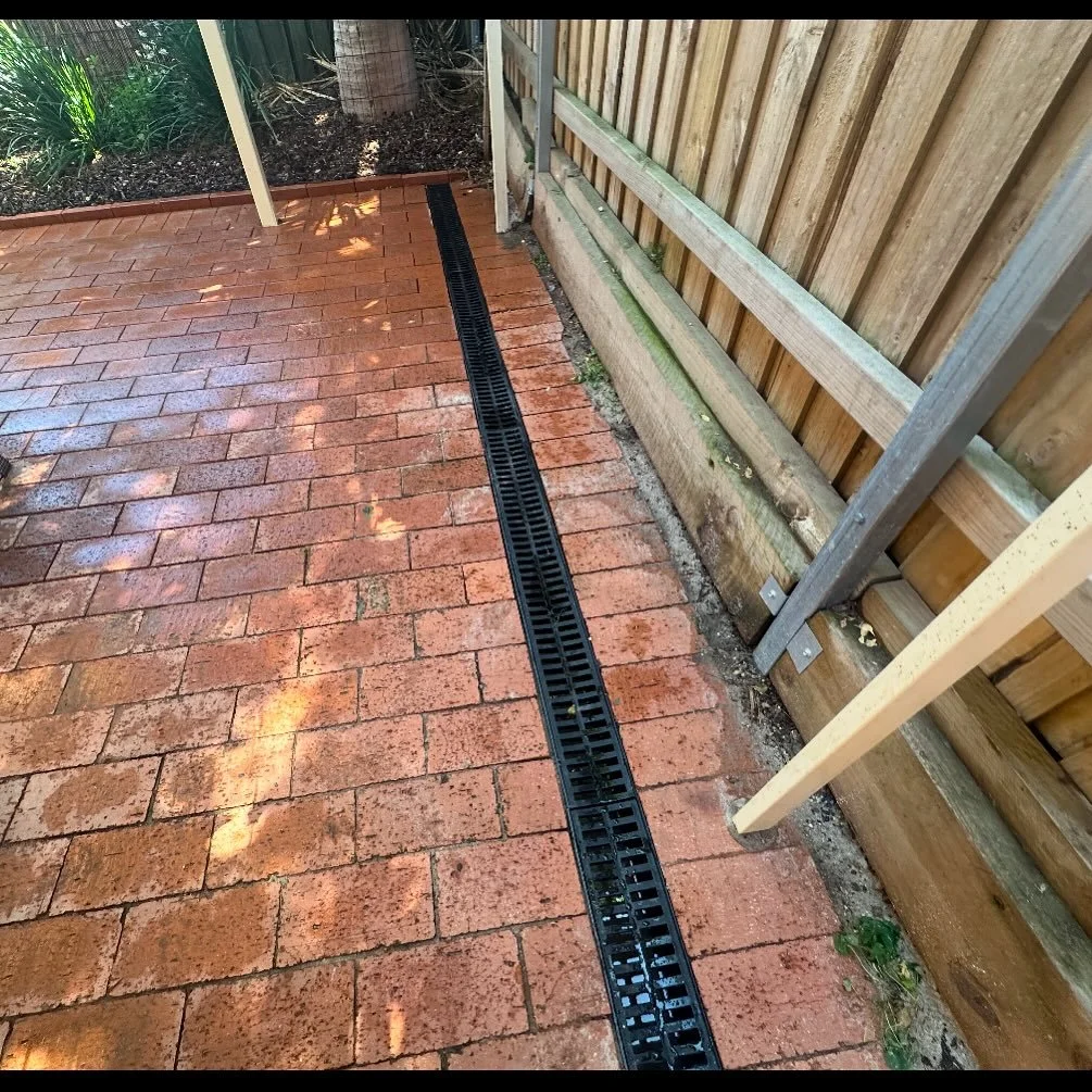 New drain installed to resolve surface water issues.